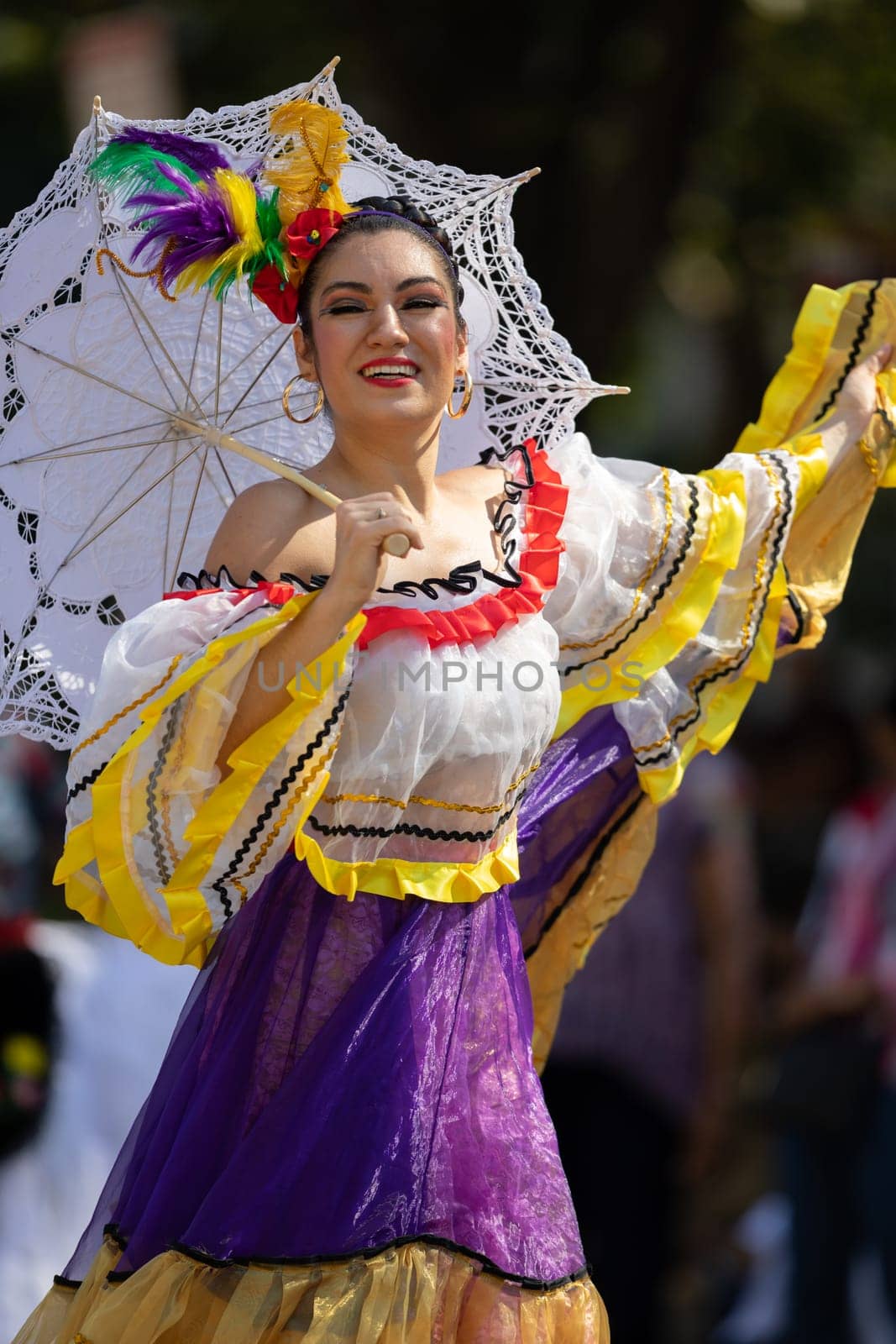 Washington, D.C., USA - September 29, 2018: The Fiesta DC Parade, Mexican woman wearing traditional clothing dancing