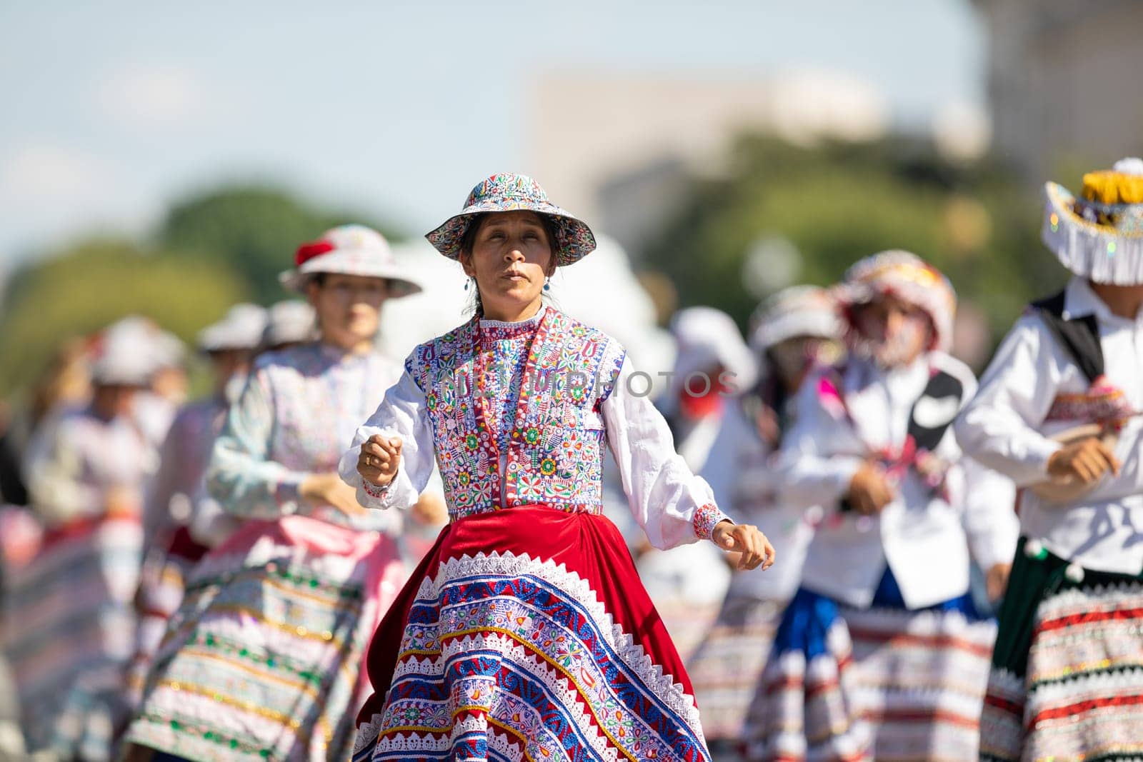 Washington, D.C., USA - September 29, 2018: The Fiesta DC Parade, Peruvian women wearing traditional clothing danicng during the parade