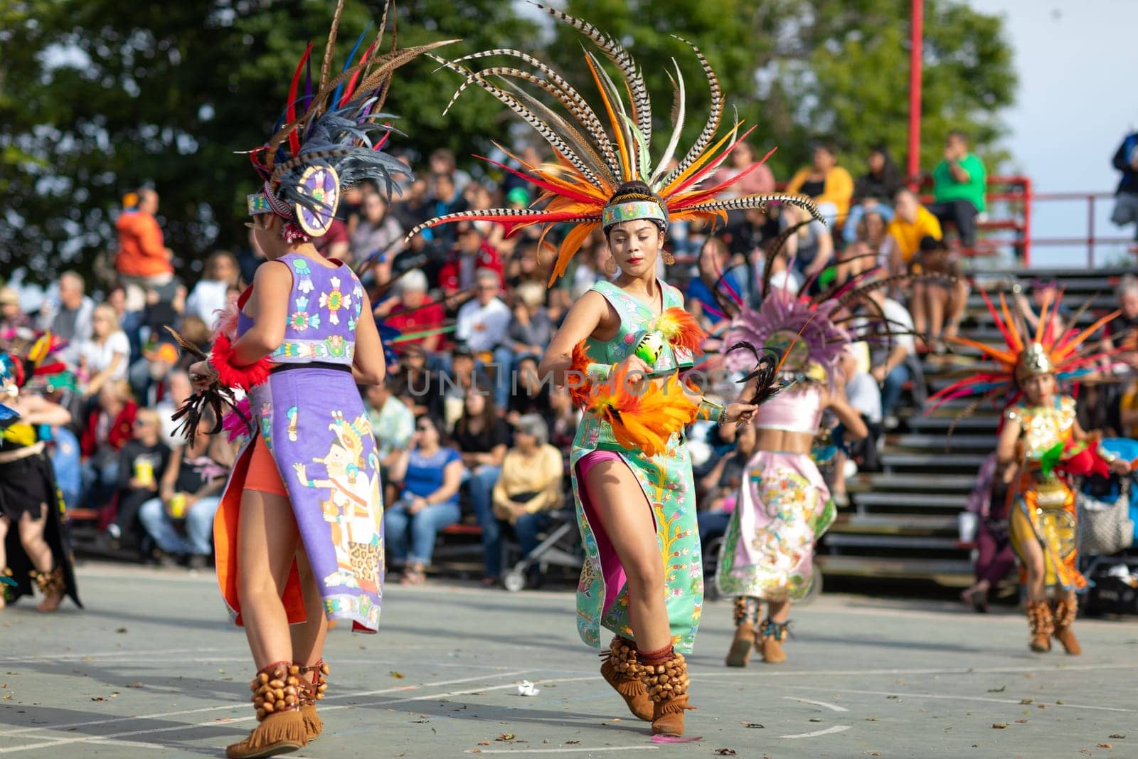 Milwaukee, Wisconsin, USA - September 8, 2018 The Indian Summer Festival: Men women and children members of the Dance Academy of Mexico performing Aztec Dance