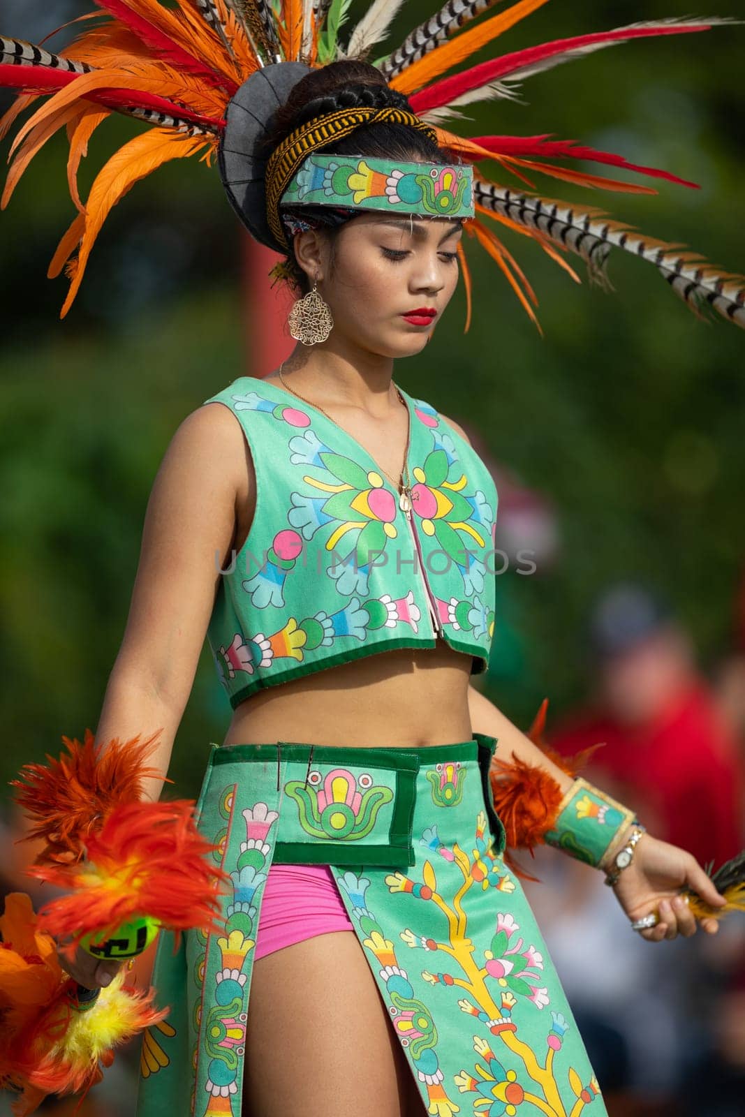 Milwaukee, Wisconsin, USA - September 8, 2018 The Indian Summer Festival: Men women and children members of the Dance Academy of Mexico performing Aztec Dance