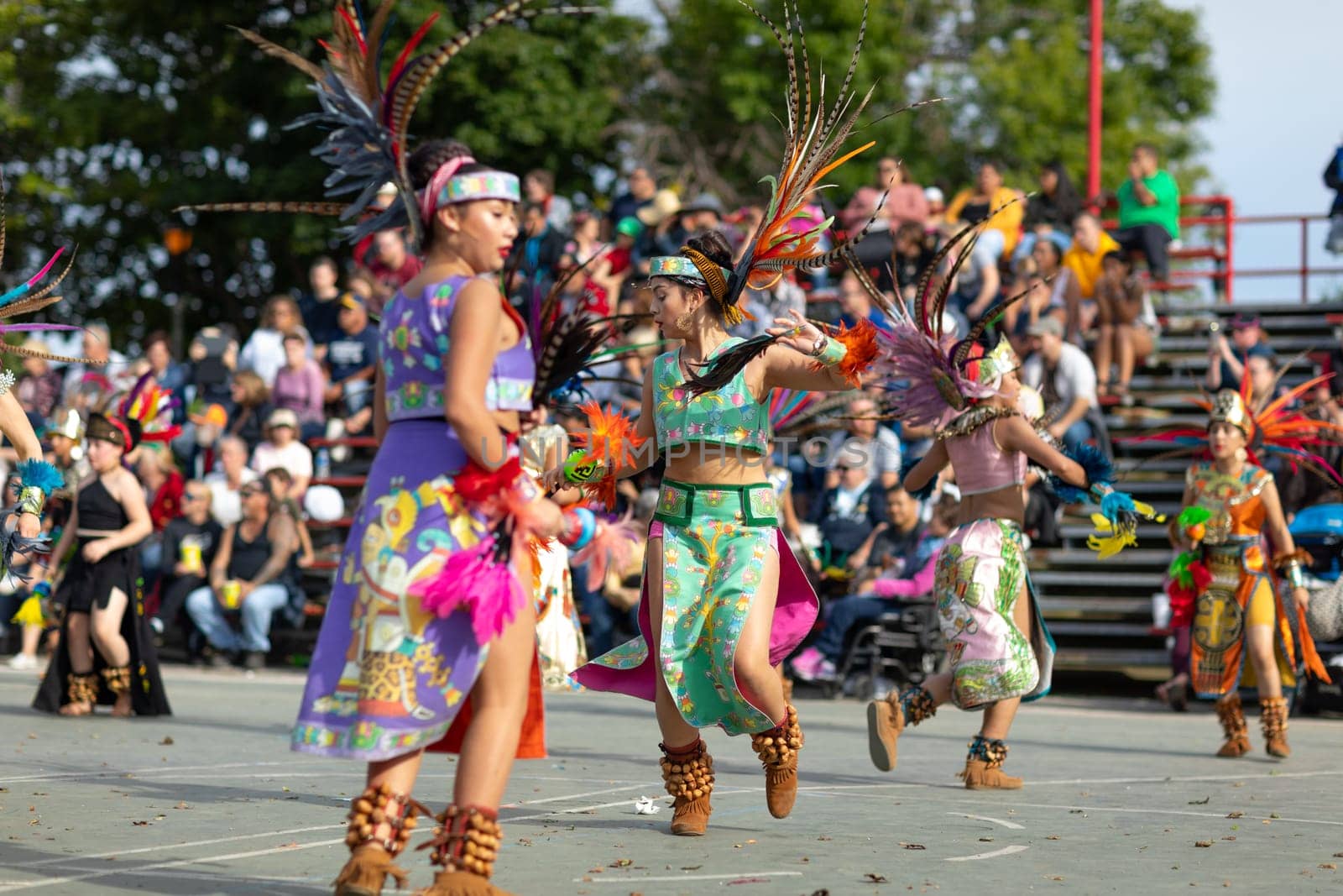 Milwaukee, Wisconsin, USA - September 8, 2018 The Indian Summer Festival: Men women and children members of the Dance Academy of Mexico performing Aztec Dance