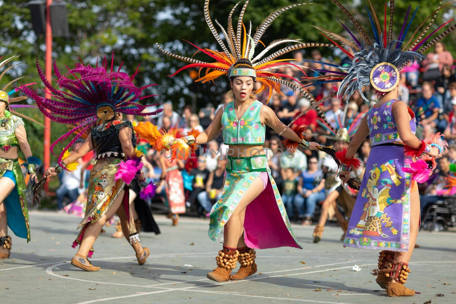 Milwaukee, Wisconsin, USA - September 8, 2018 The Indian Summer Festival: Men women and children members of the Dance Academy of Mexico performing Aztec Dance