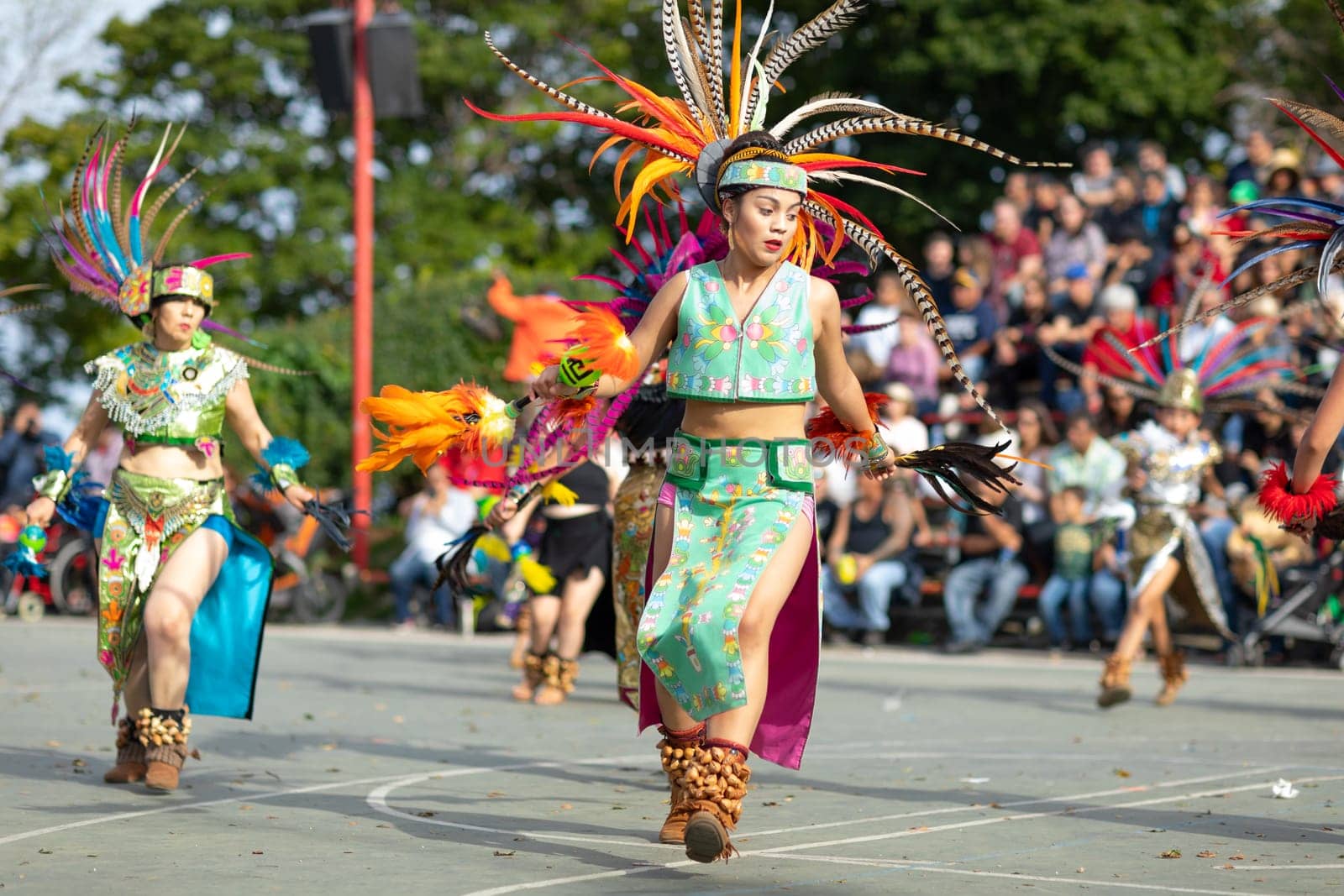 Milwaukee, Wisconsin, USA - September 8, 2018 The Indian Summer Festival: Men women and children members of the Dance Academy of Mexico performing Aztec Dance