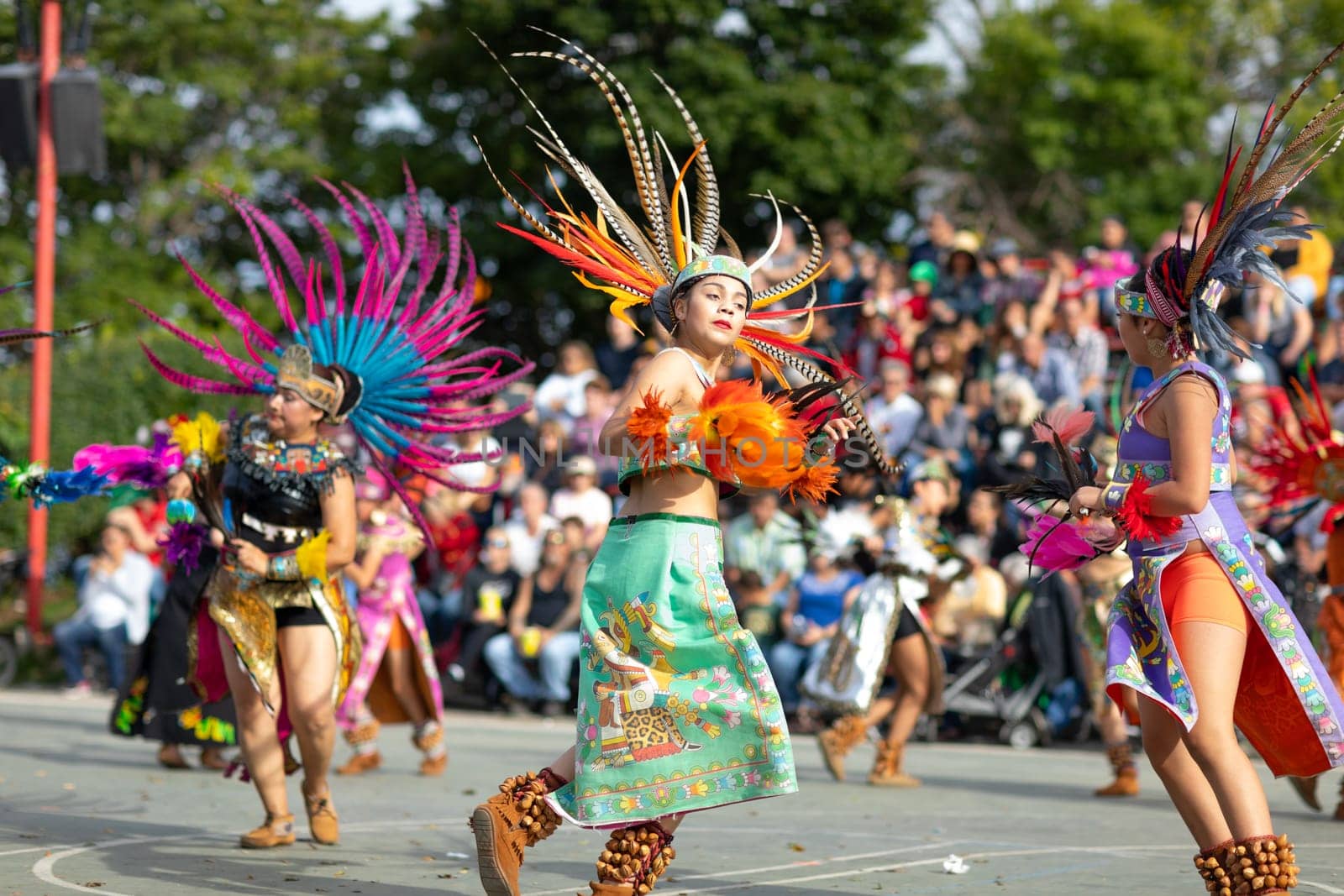 Milwaukee, Wisconsin, USA - September 8, 2018 The Indian Summer Festival: Men women and children members of the Dance Academy of Mexico performing Aztec Dance