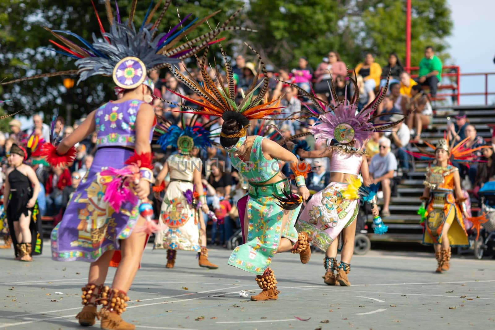 Milwaukee, Wisconsin, USA - September 8, 2018 The Indian Summer Festival: Men women and children members of the Dance Academy of Mexico performing Aztec Dance