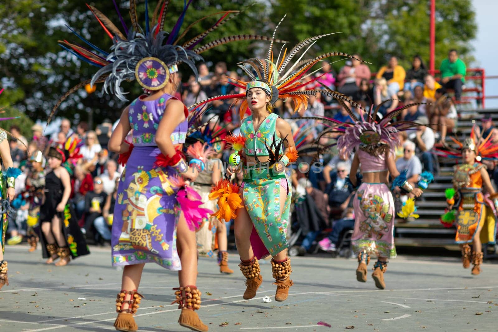 Milwaukee, Wisconsin, USA - September 8, 2018 The Indian Summer Festival: Men women and children members of the Dance Academy of Mexico performing Aztec Dance