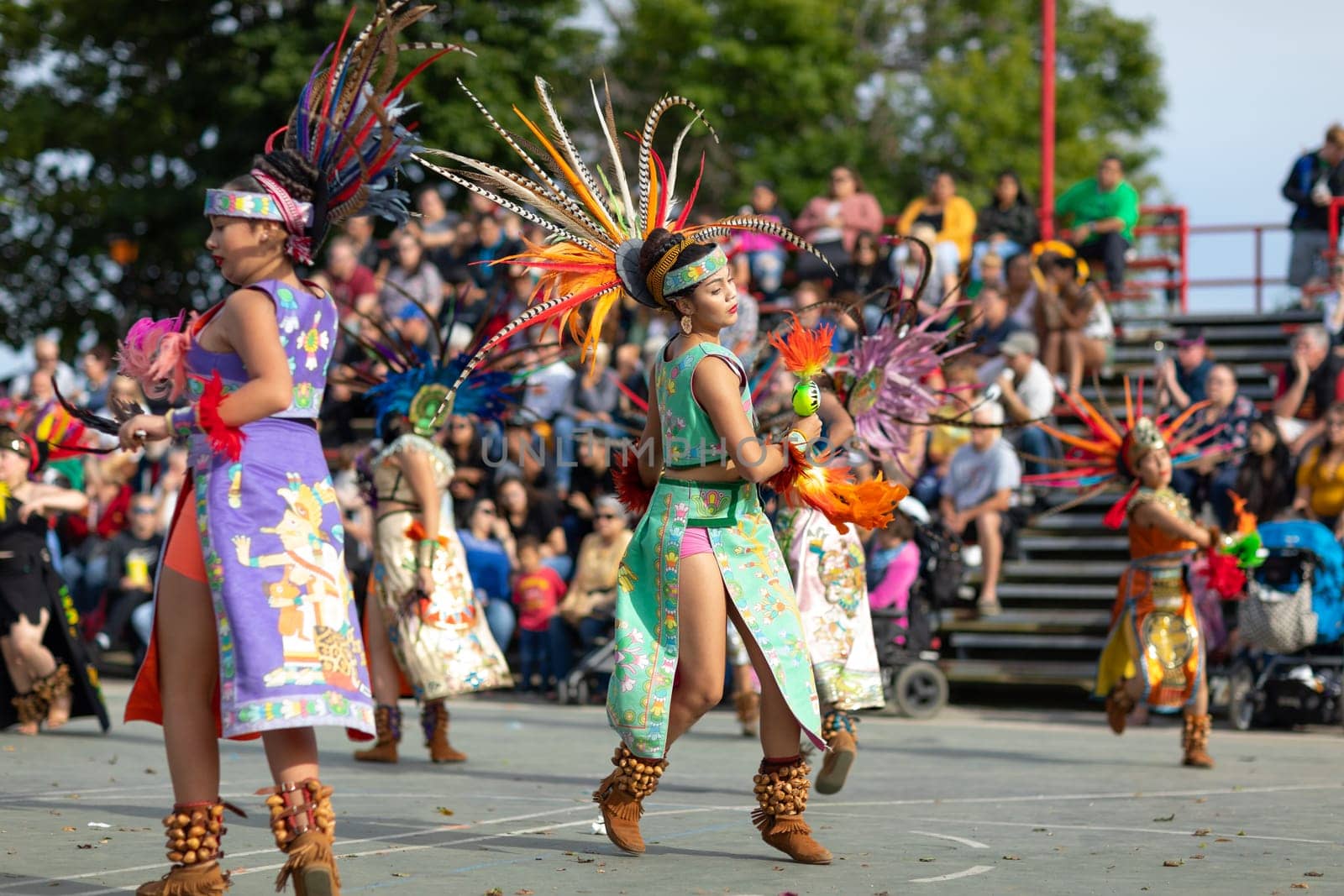 Milwaukee, Wisconsin, USA - September 8, 2018 The Indian Summer Festival: Men women and children members of the Dance Academy of Mexico performing Aztec Dance