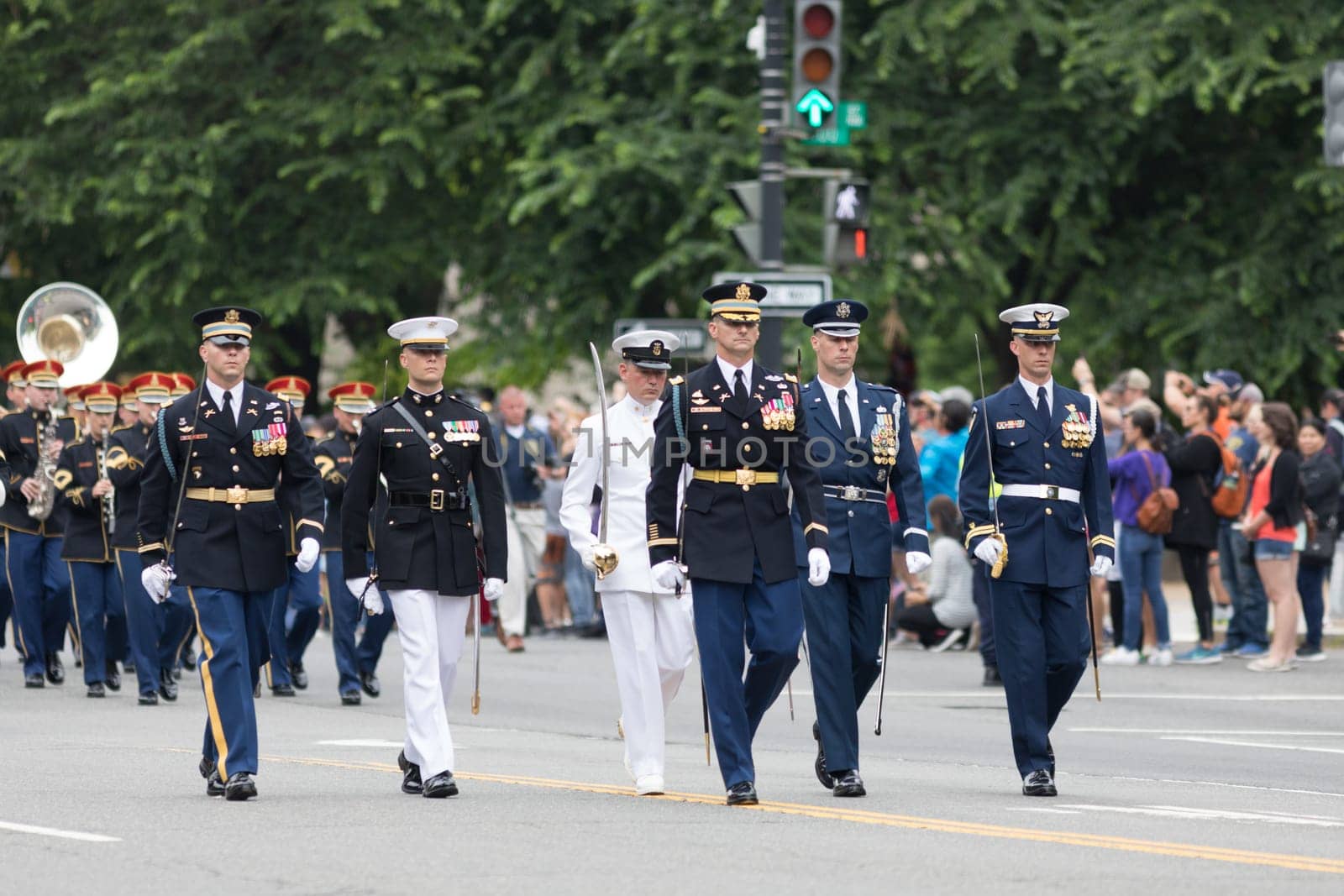 Washington, D.C., USA - May 28, 2018: The National Memorial Day Parade, Members of diferent branches of the United States Military in uniform marching together holding swords