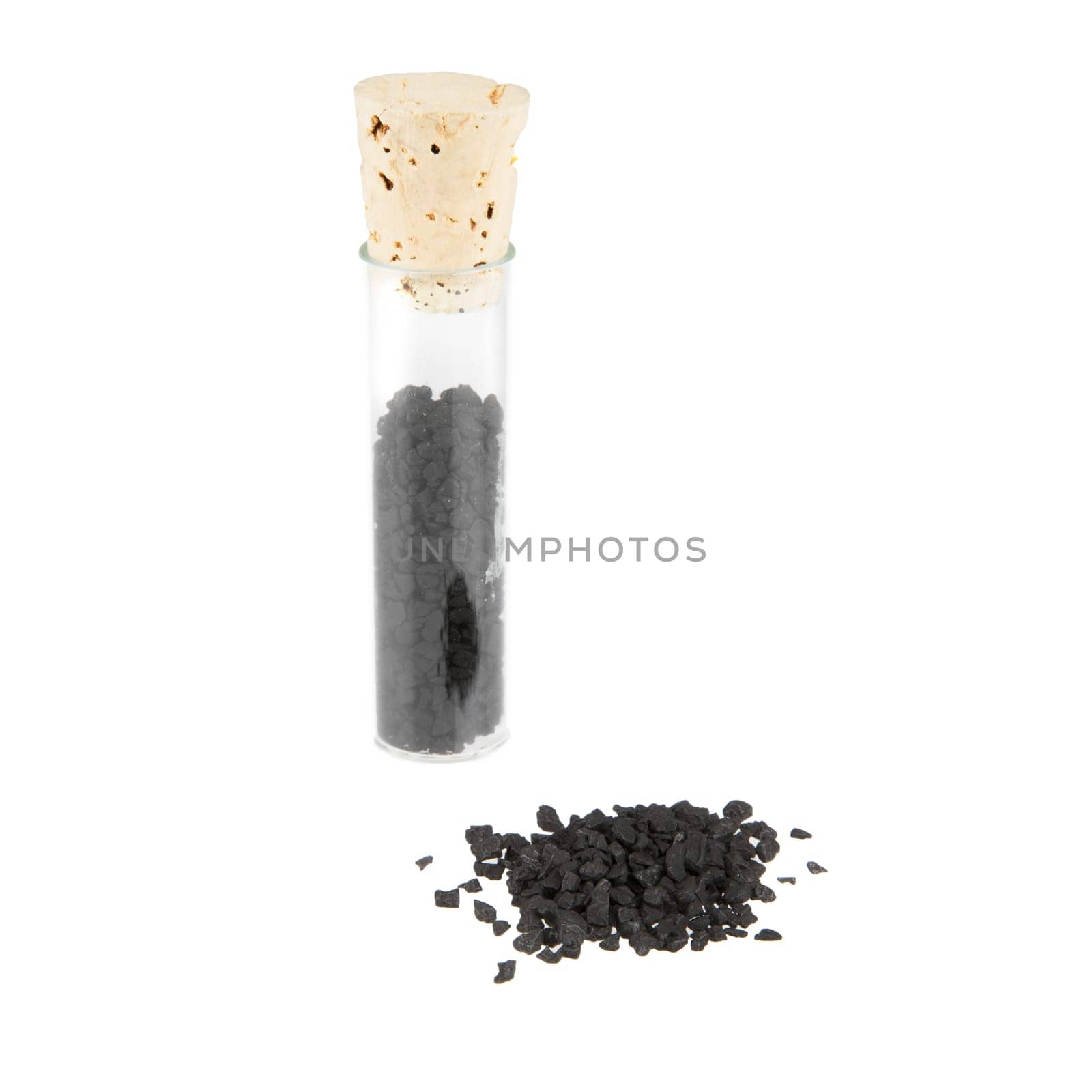 Black Hawaiian sea salt with corked glass jar isolated on white.