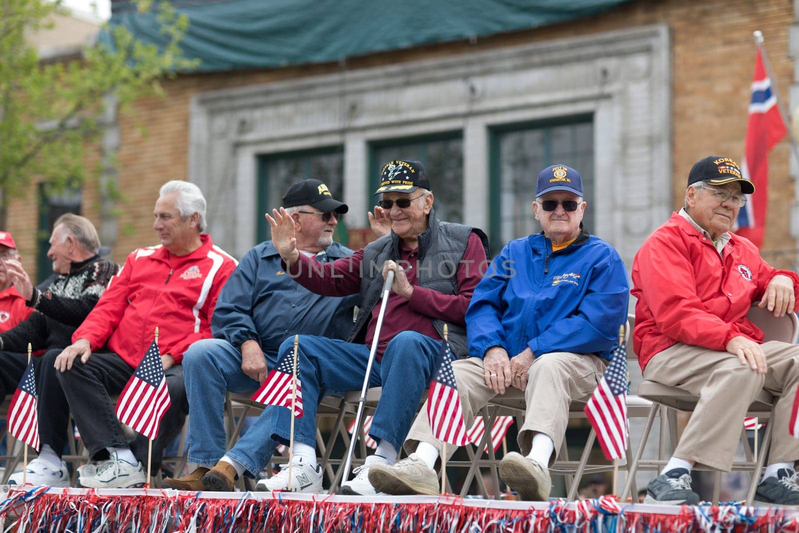 Stoughton, Wisconsin, USA - May 20, 2018: Annual Norwegian Parade, Military Veterans transported by a semi-truck during the parade