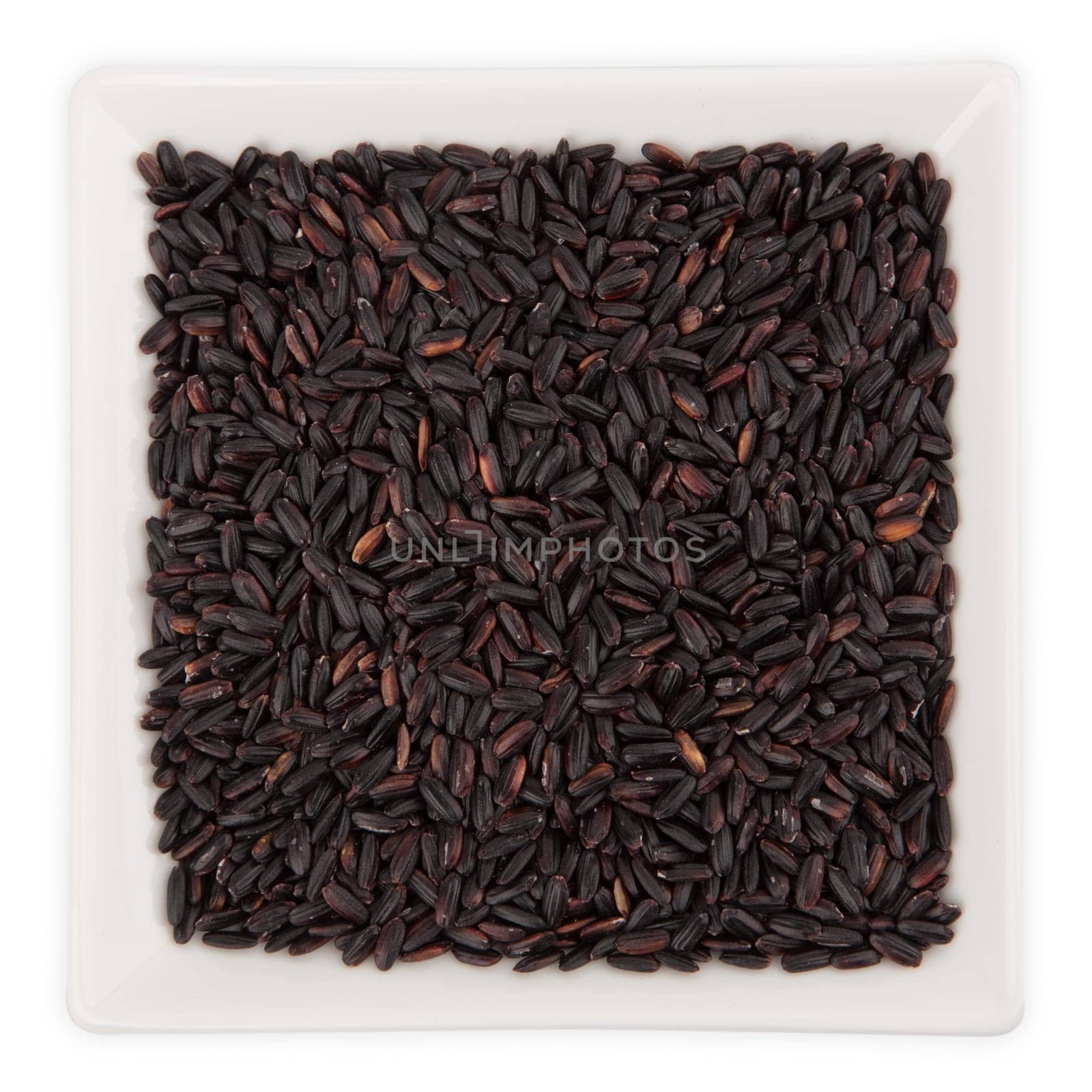 Black Rice in a Bowl isolated on white background