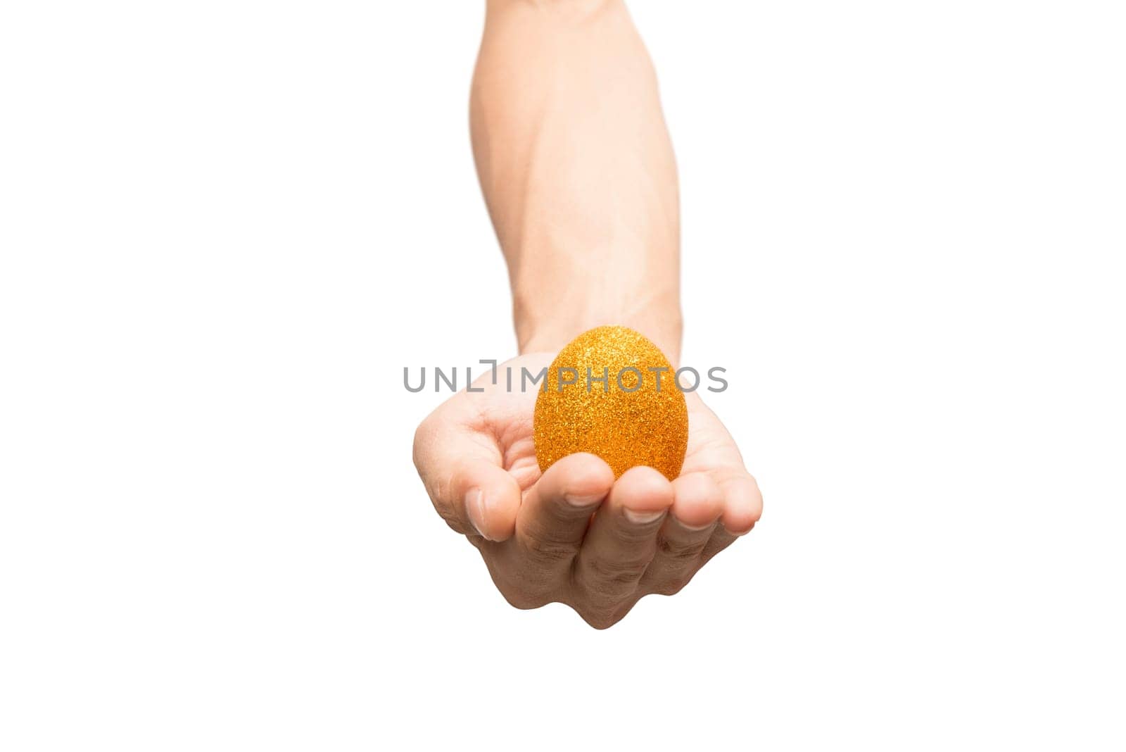 Human hand holding yellow easter egg isolated over white background. Happy Easter