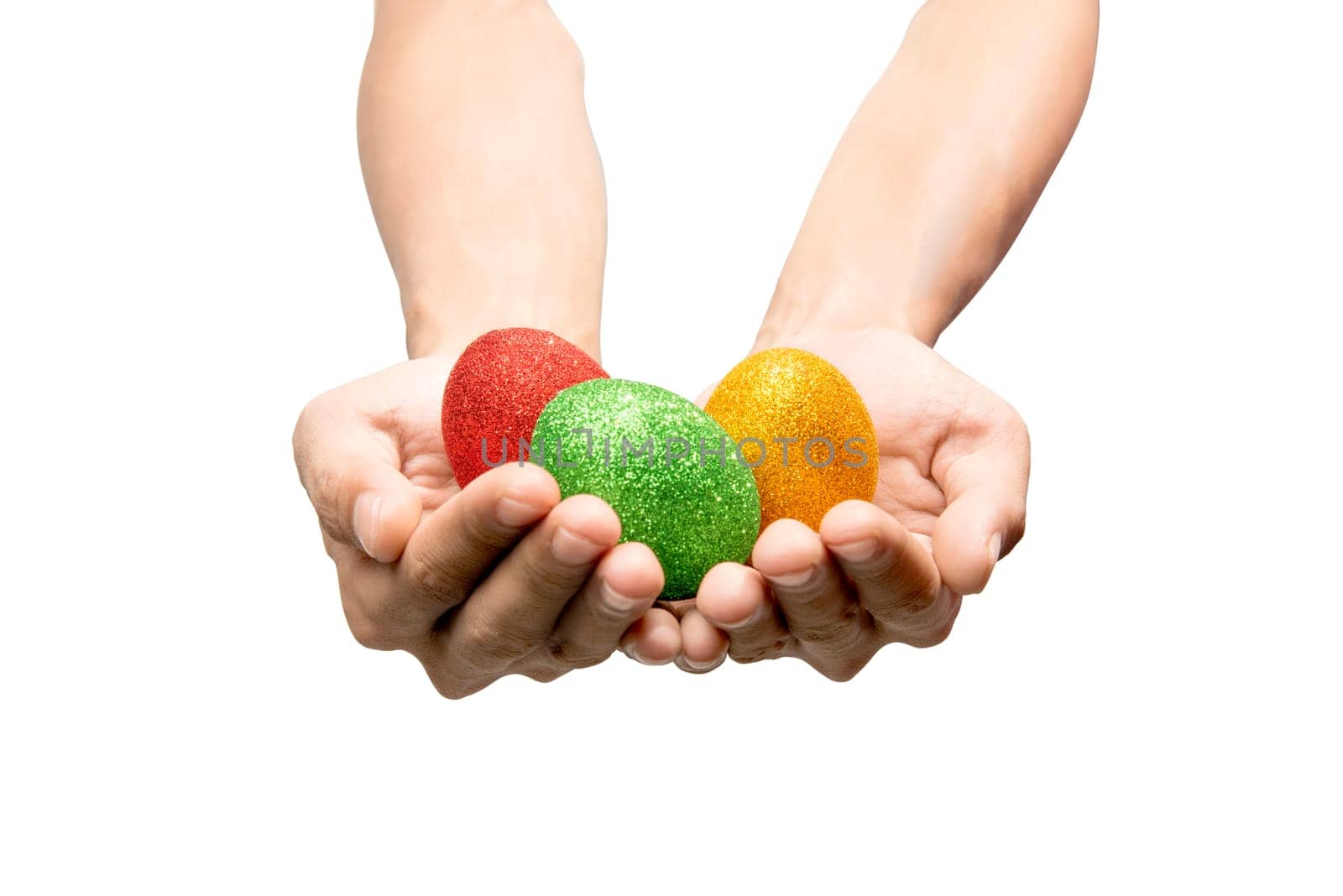 Human hands holding colorful easter eggs isolated over white background. Happy Easter