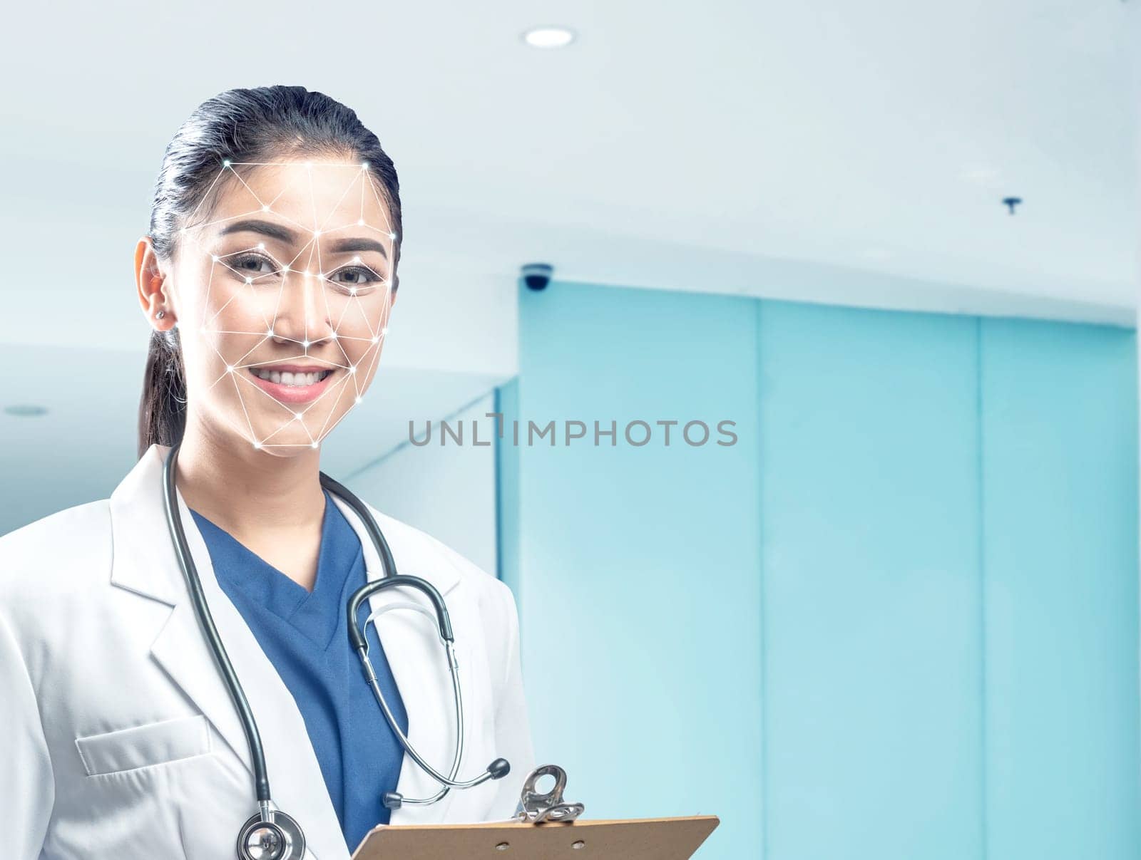 Pretty asian female doctor in white coat and stethoscope holding clipboard using face recognition over hospital background. Modern technology concept