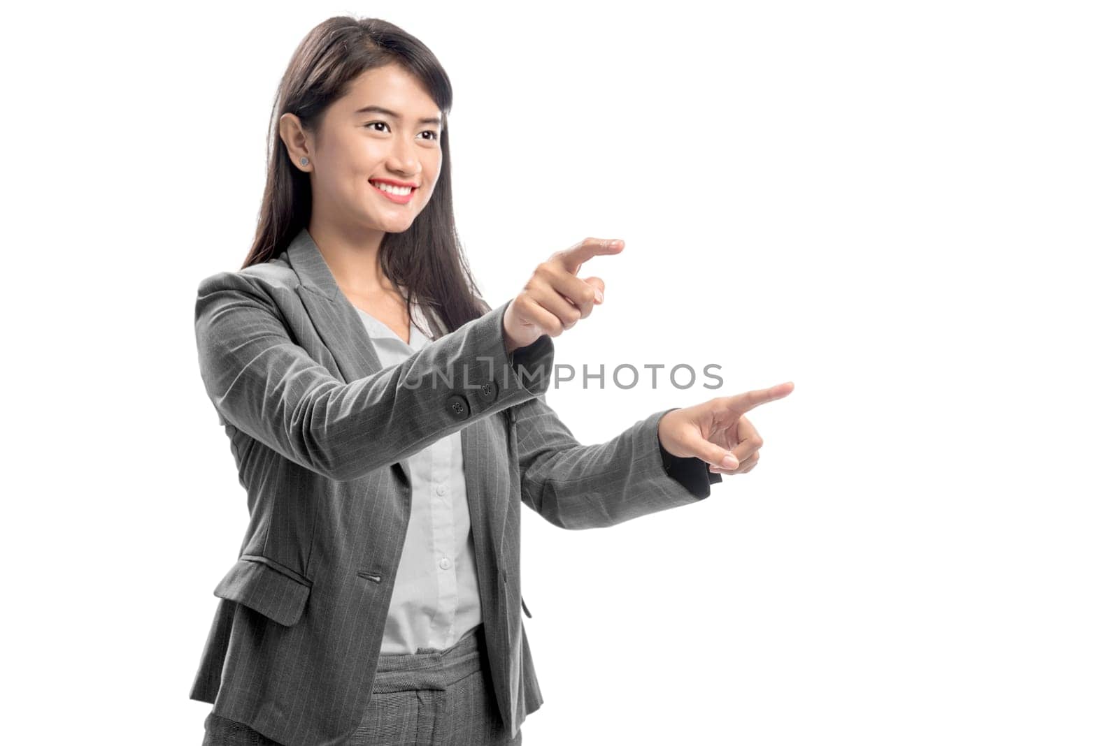 Portrait of asian business woman touching something with her finger posing isolated over white background