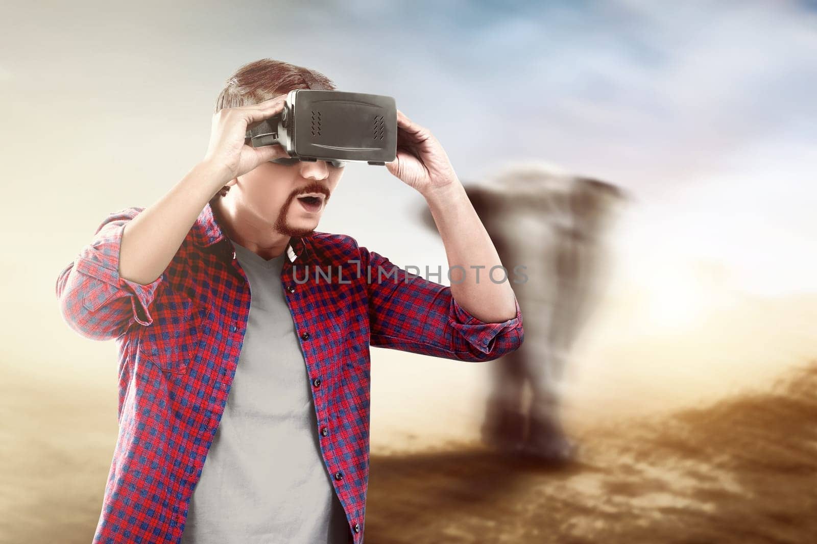 Asian man looking at blurry wild animals with virtual reality device. Augmented reality technology