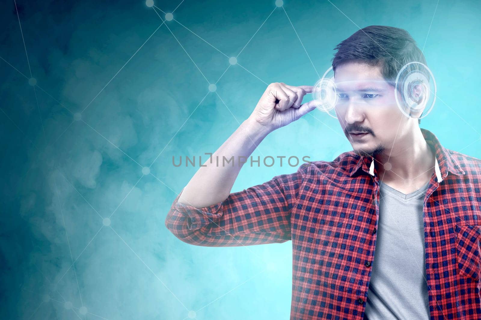 Asian man looking at digital interface with virtual glasses device. Augmented reality technology