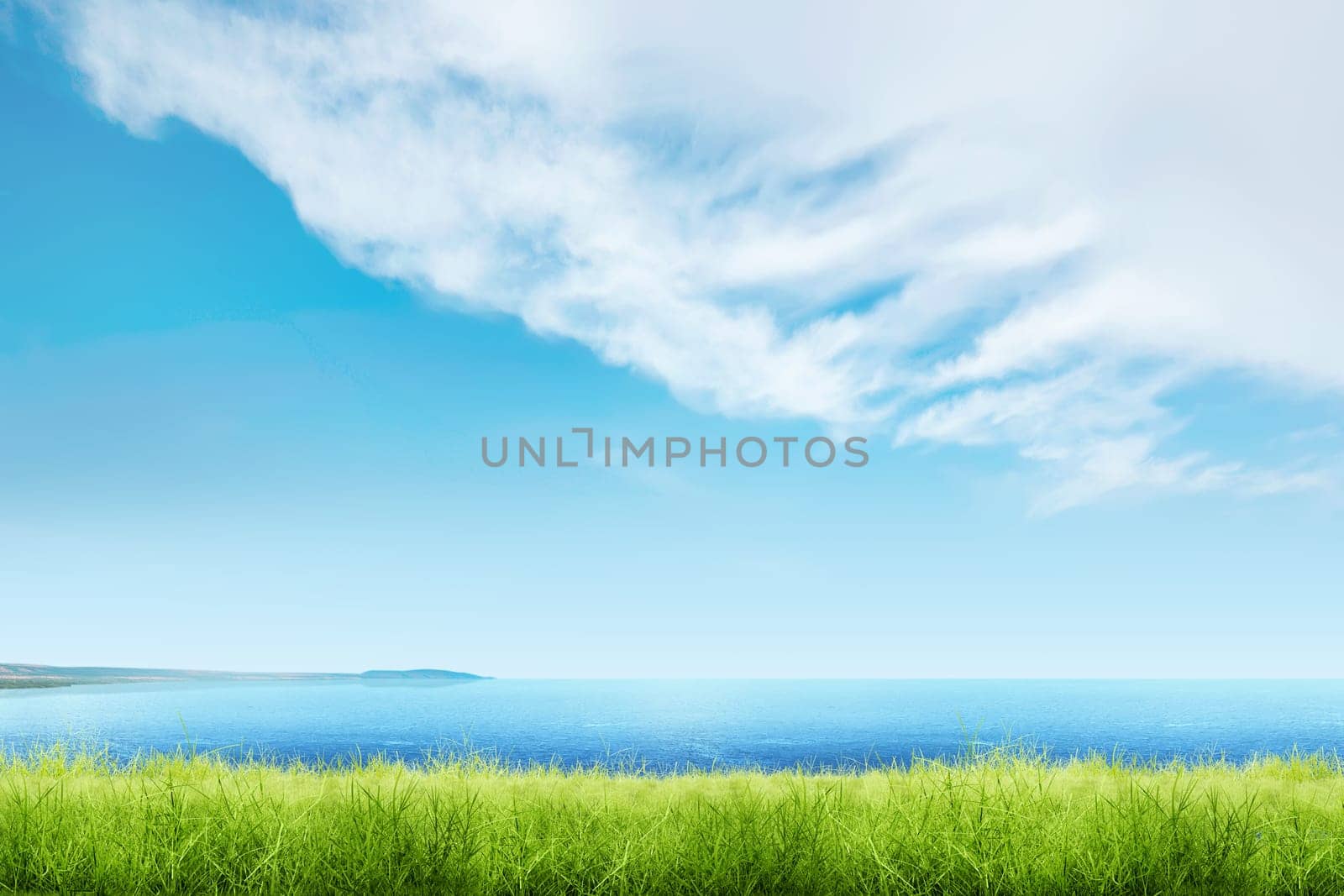Green grass with blue ocean view and cloudscapes over blue sky background
