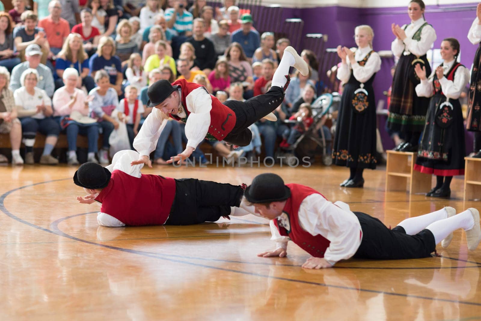 Stoughton, Wisconsin, USA - May 19, 2018 The Stoughton Norwegian Dancers, wearing traditional clothing from norway, perform traditional dances at the Community Building Performance, during the Syttende Mai Stoughton festival, Norwegian Constitution Day.