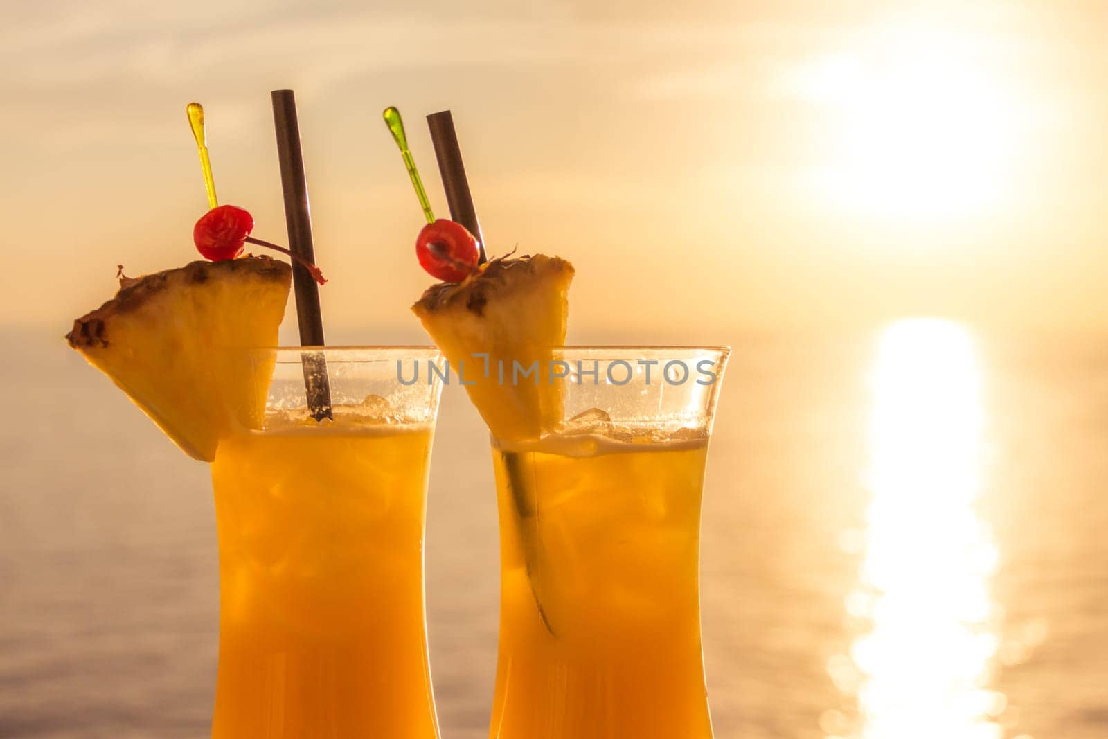 Fresh cool juicy orange pineapple coktails. Perfect wellness drink for enjoyment and relaxation at holiday cruise or vacation travel.