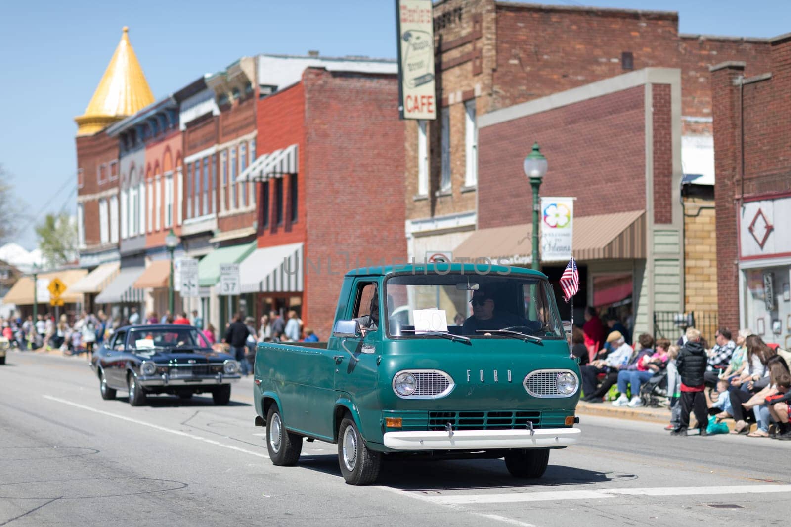 Orleans, Indiana, USA - April 28, 2018: The Orleans DogWood Festival and Parade, A classic truck going down the street during the parade A Ford Econoline Heavy Duty color green