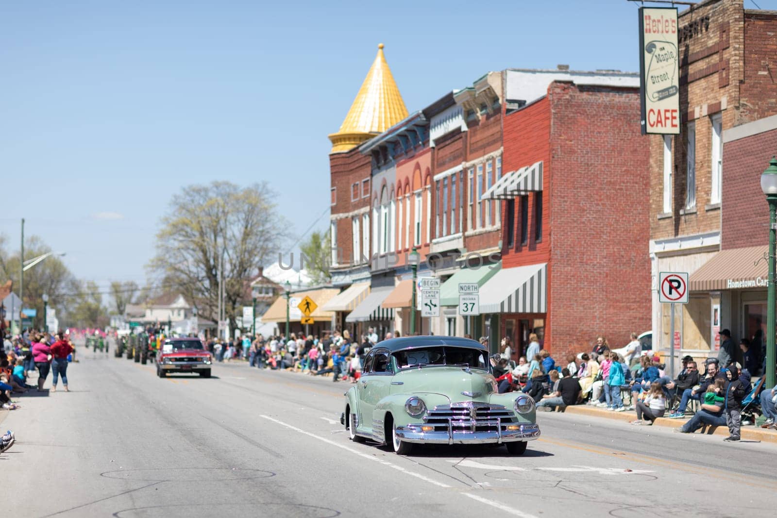 Orleans, Indiana, USA - April 28, 2018: The Orleans DogWood Festival and Parade, A classic car going down the street during the parade, a Chevrolet Fleetline color green