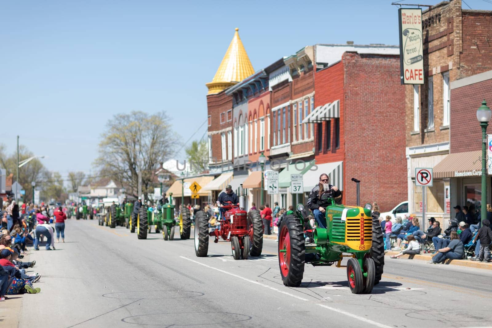 Orleans, Indiana, USA - April 28, 2018: The Orleans DogWood Festival and Parade, An Oliver 1966  classic tractor going down the street downtown Orleans
