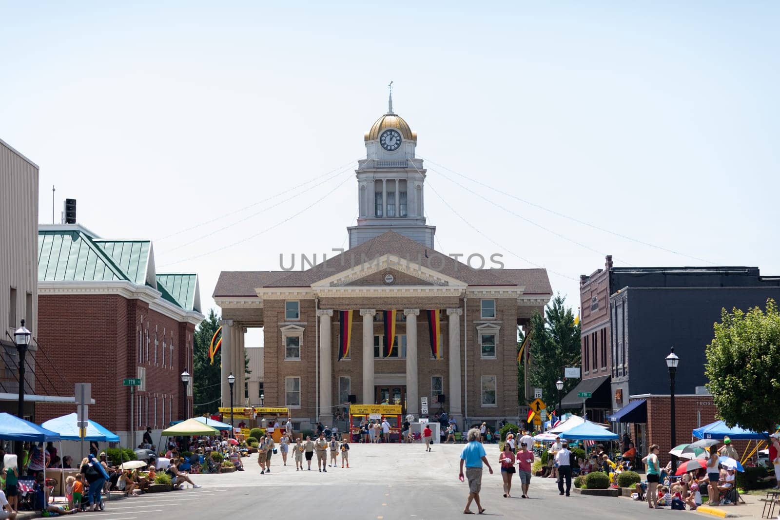 Jasper, Indiana, USA - August 5, 2018: The Strassenfest Parade, Photo of the Dubois County Courthouse, flying german flags, prior to the Strassenfest Parade.