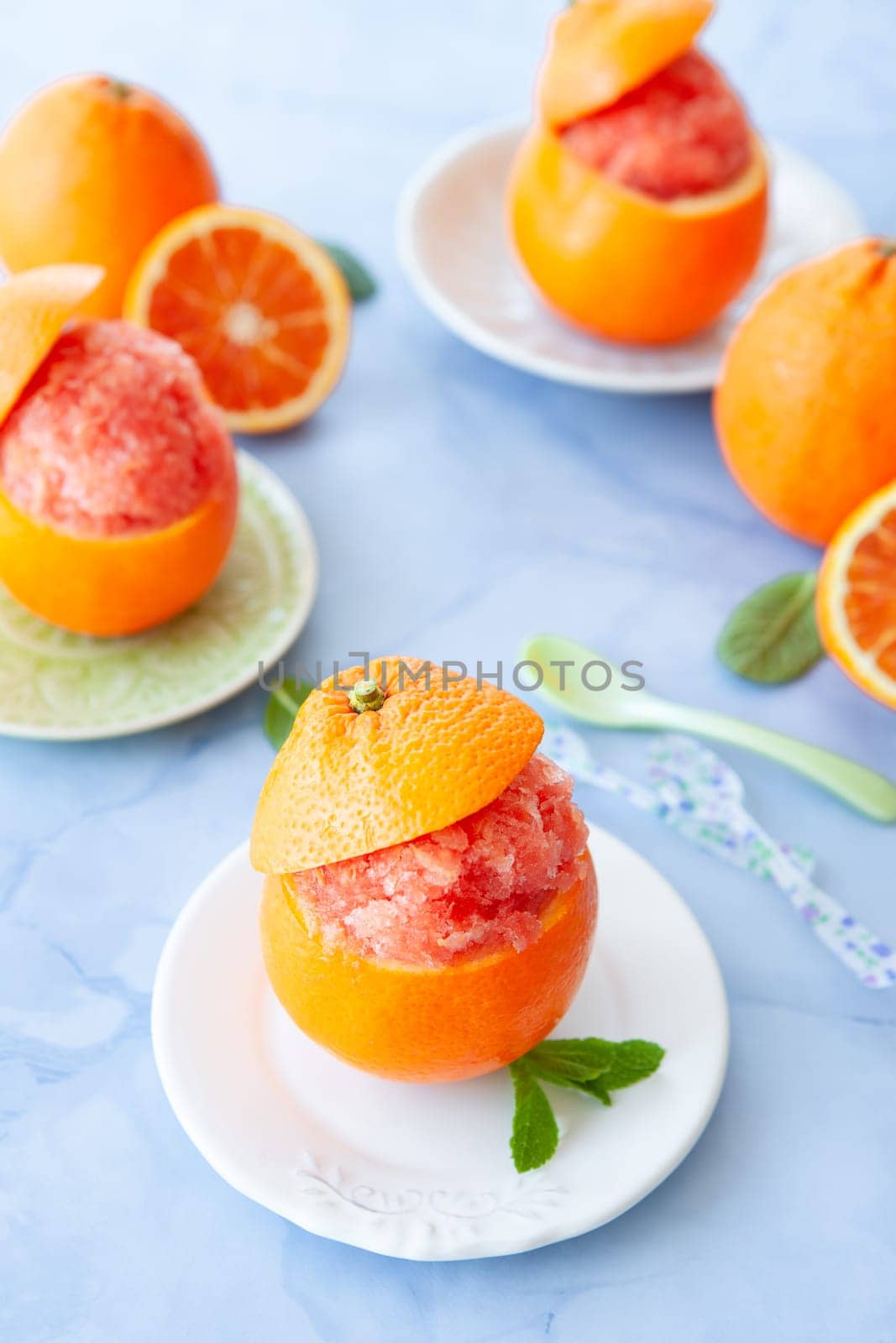 Refreshing orange sorbet served in a fresh blood orange