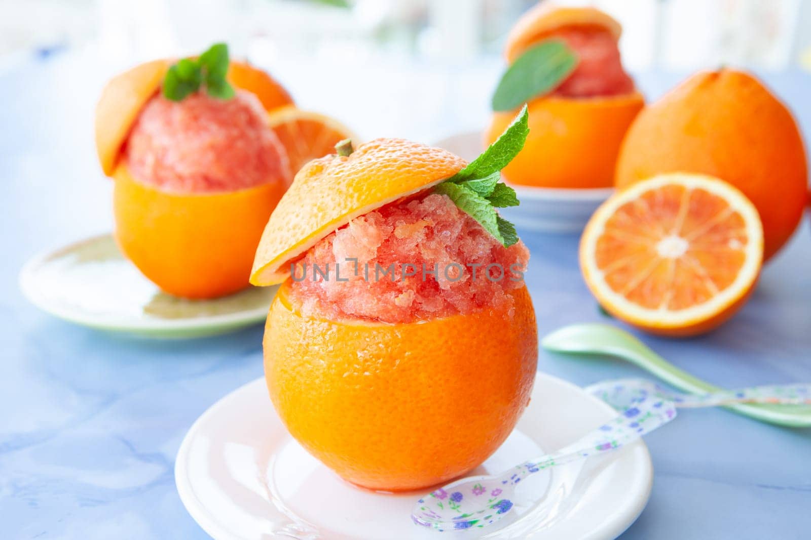 Refreshing orange sorbet served in a fresh blood orange