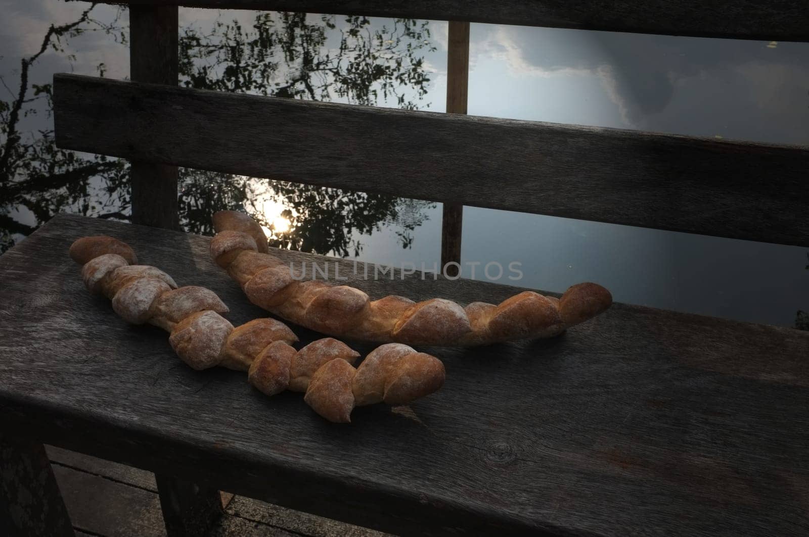 Two baguettes on the wooden chair  background . Concept Nature food , Organic food