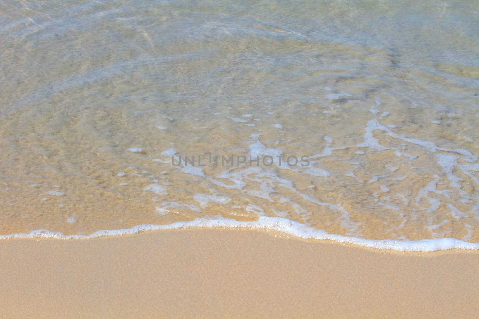 Moving of surf in the sea,Soft wave of the sea on the sandy beach