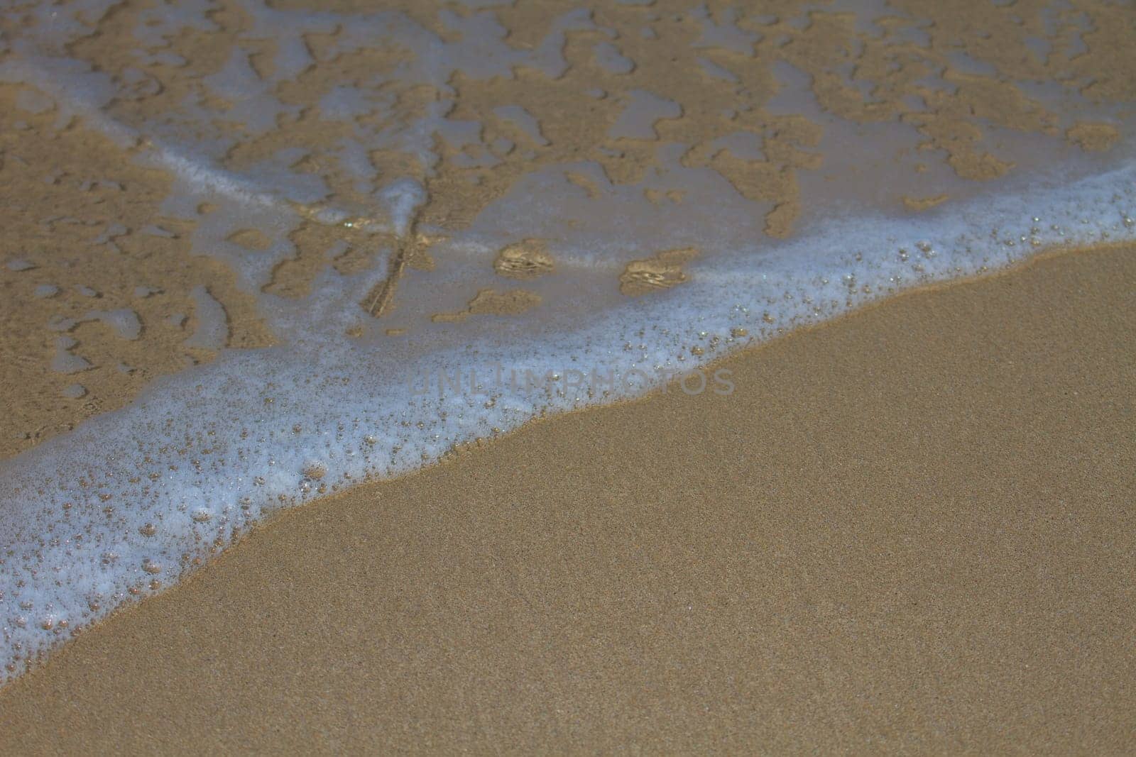 Moving of surf in the sea,Soft wave of the sea on the sandy beach