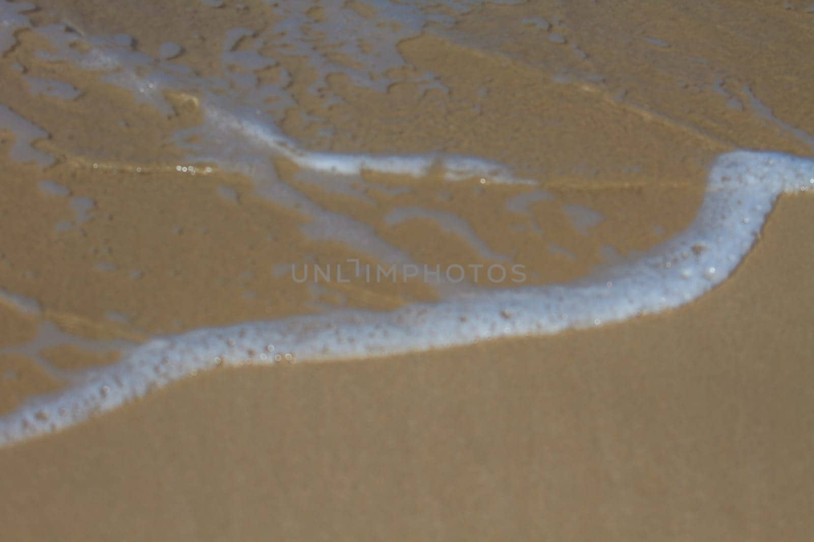 Moving of surf in the sea,Soft wave of the sea on the sandy beach