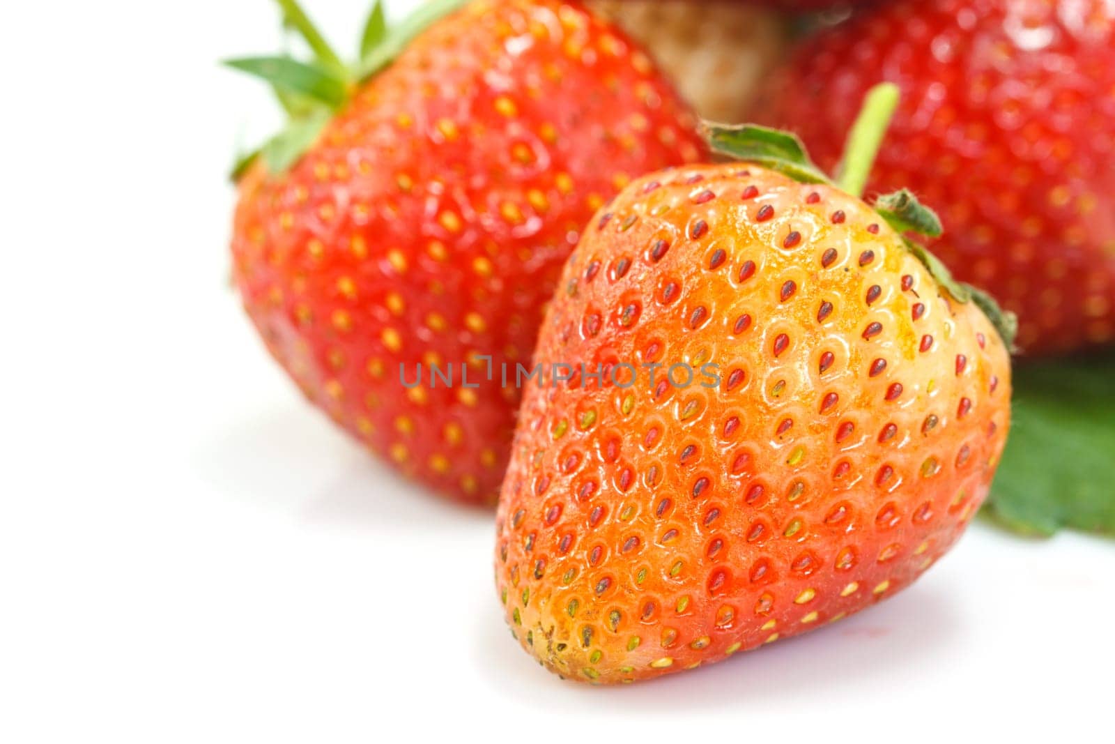 Ripe red strawberries on white background isolated