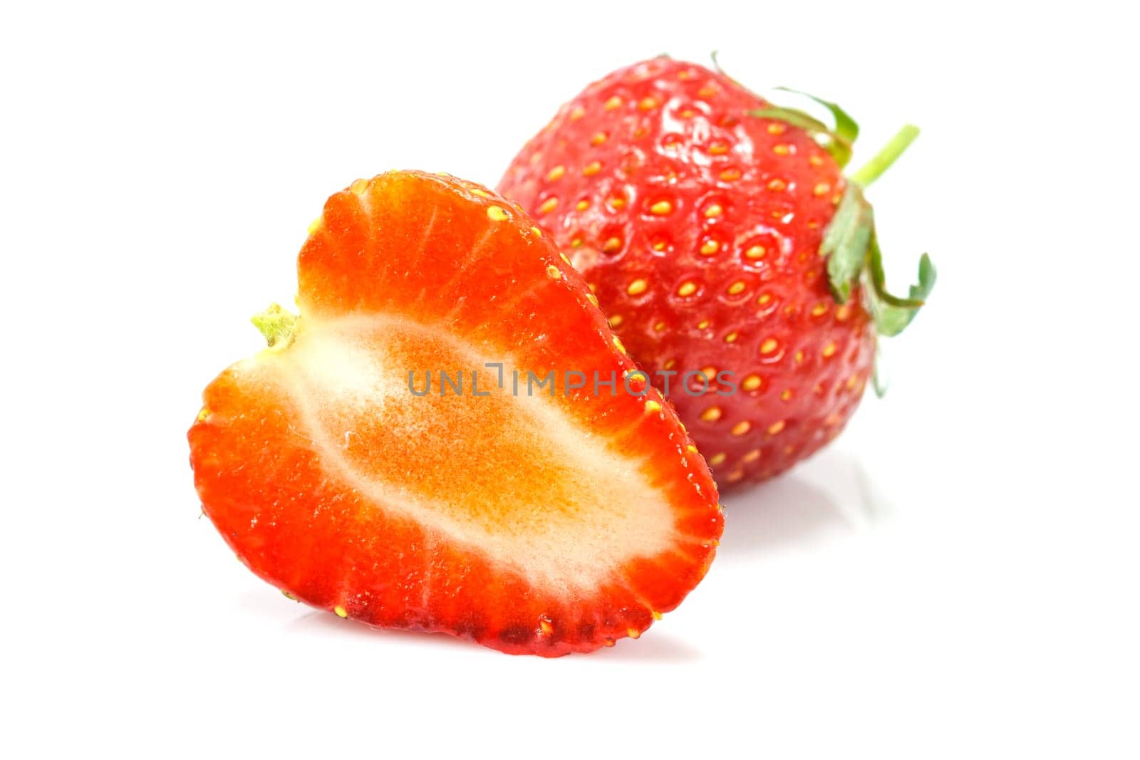 Ripe red strawberries on white background isolated
