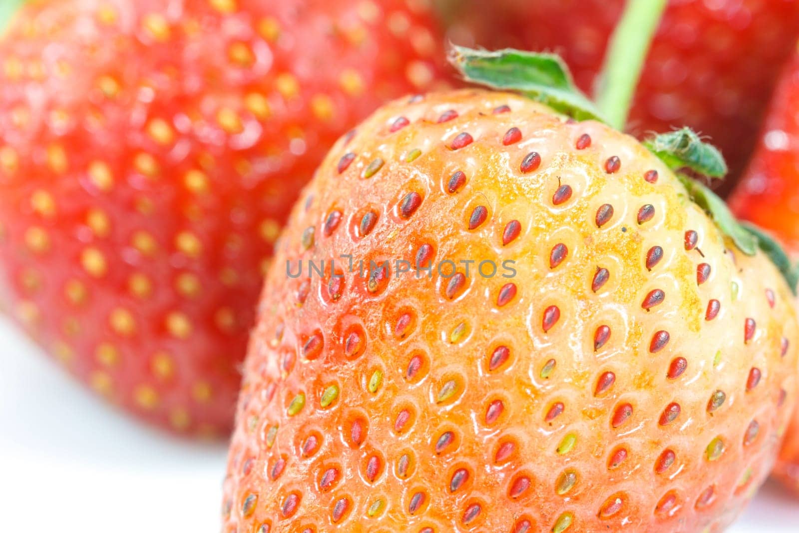 Ripe red strawberries on white background isolated