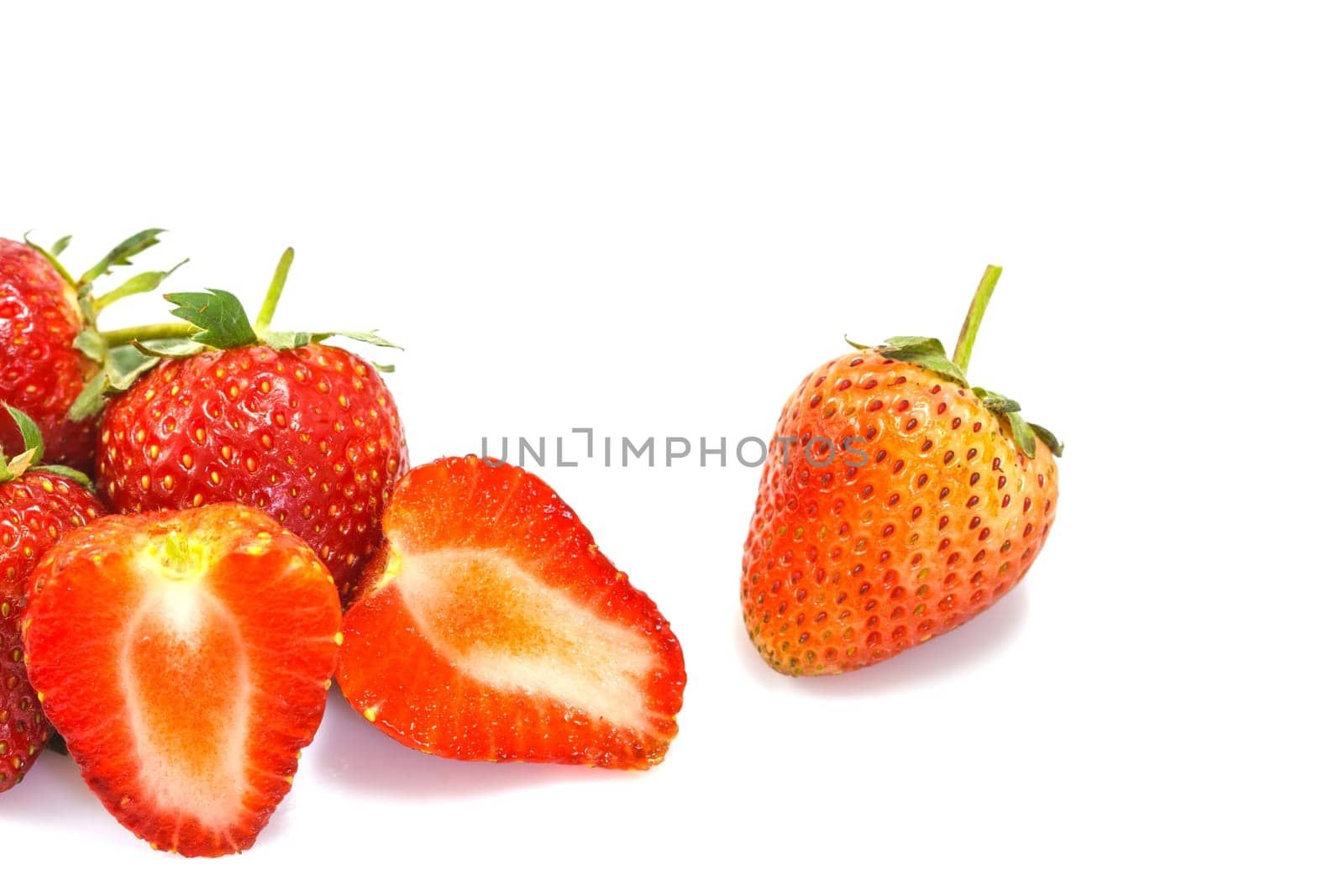 Ripe red strawberries on white background isolated
