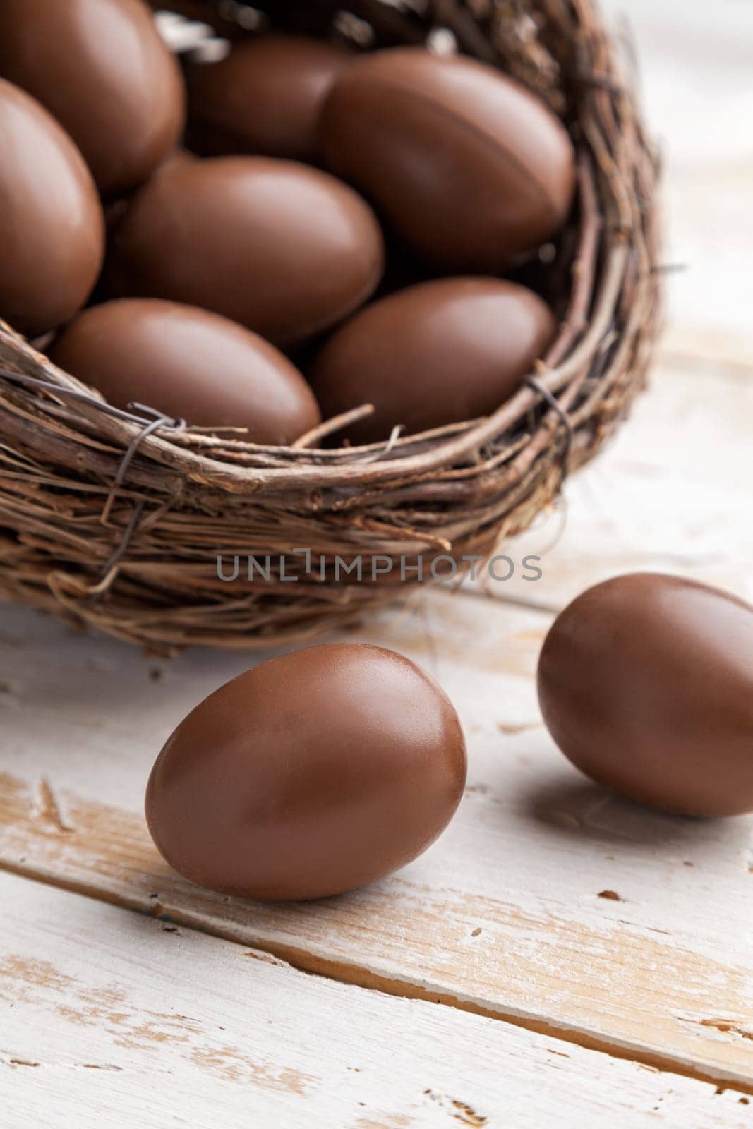 Delicious chocolate Easter holiday egg on rustic background