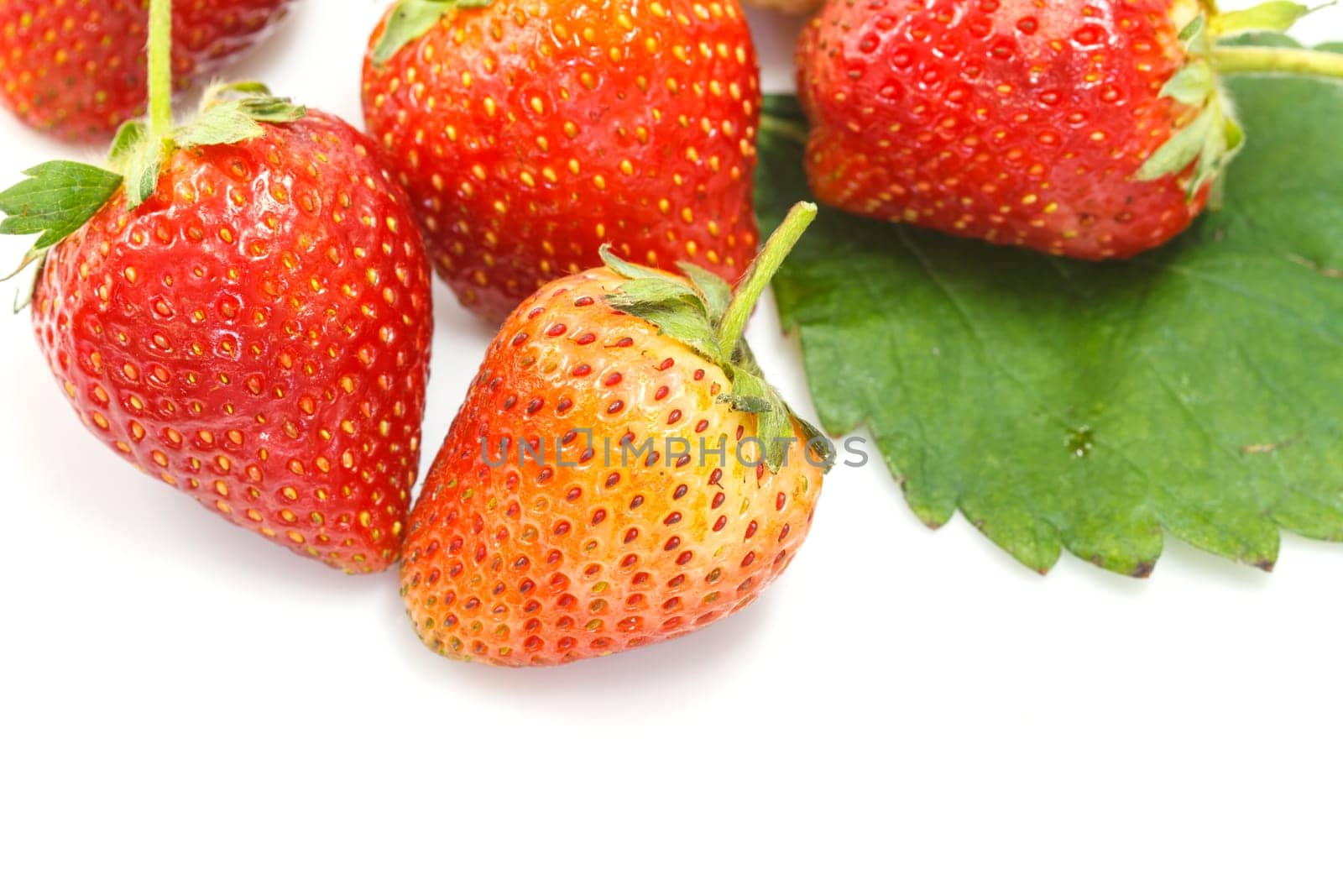 Ripe red strawberries on white background isolated