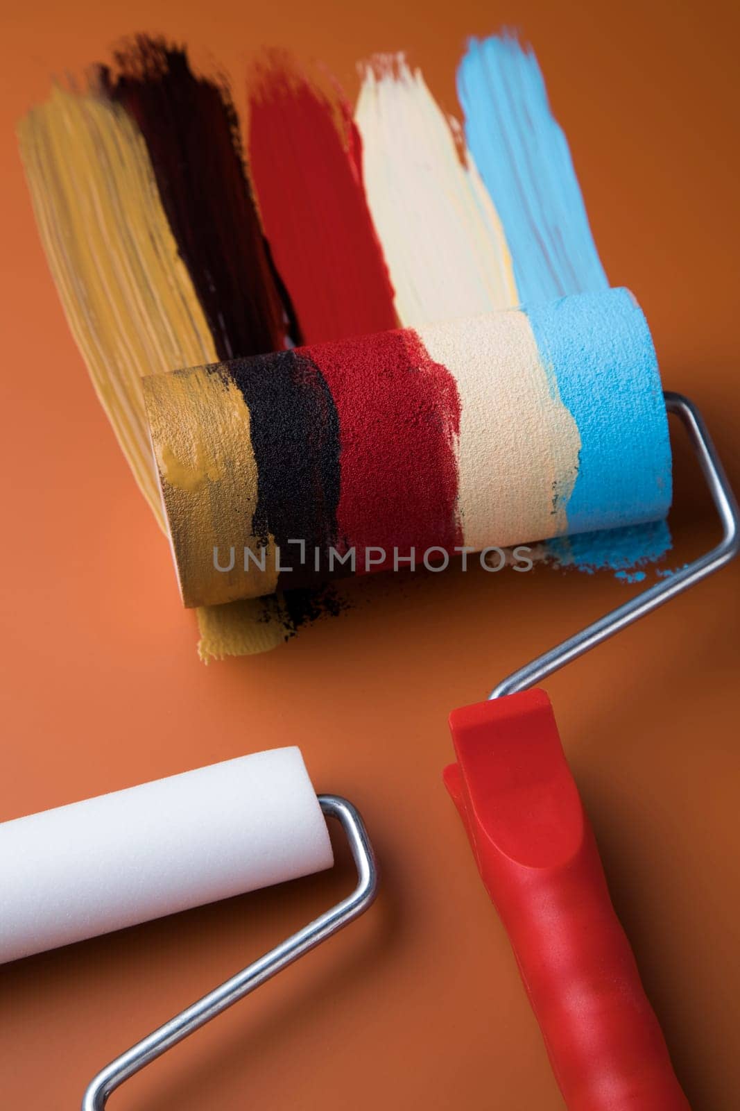 Metal tin cans with color paint and paintbrush