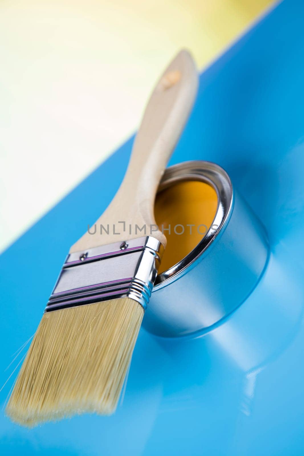 Can with paint and paintbrush