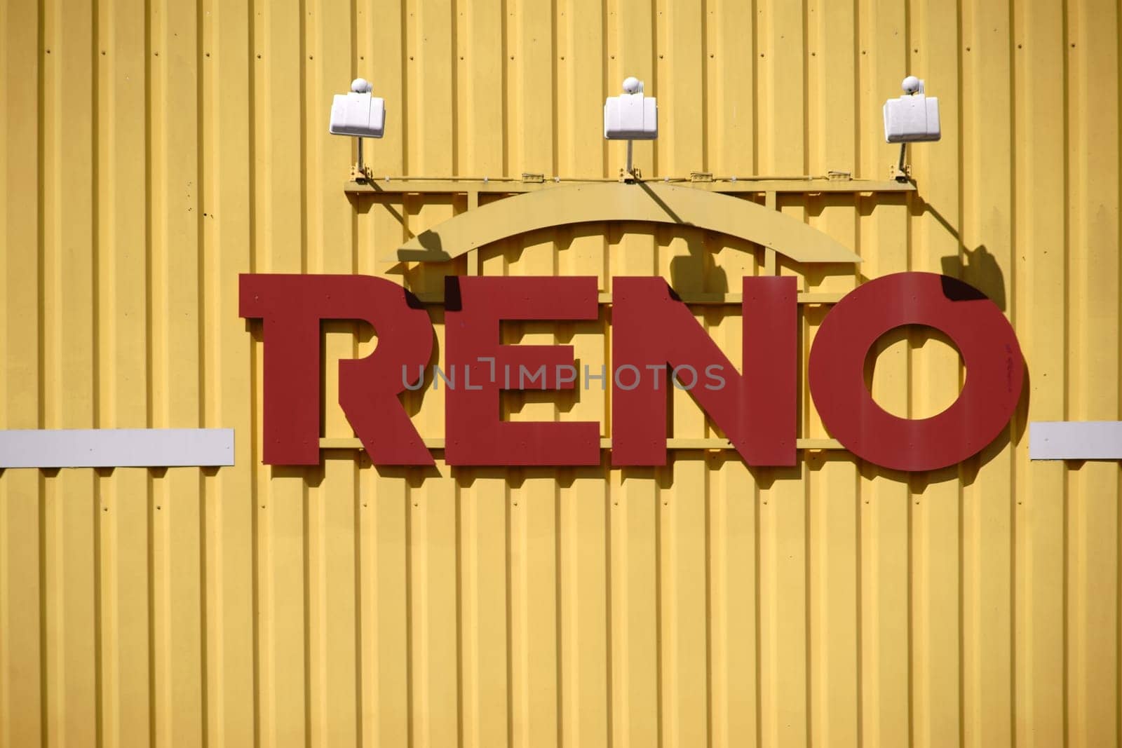 Pirmasens, Germany - March 30, 2019: The modern and colorful shrill outer facade made of corrugated metal of a shoe store of Reno shoe GmbH with logo on March 30, 2019 in Pirmasens..