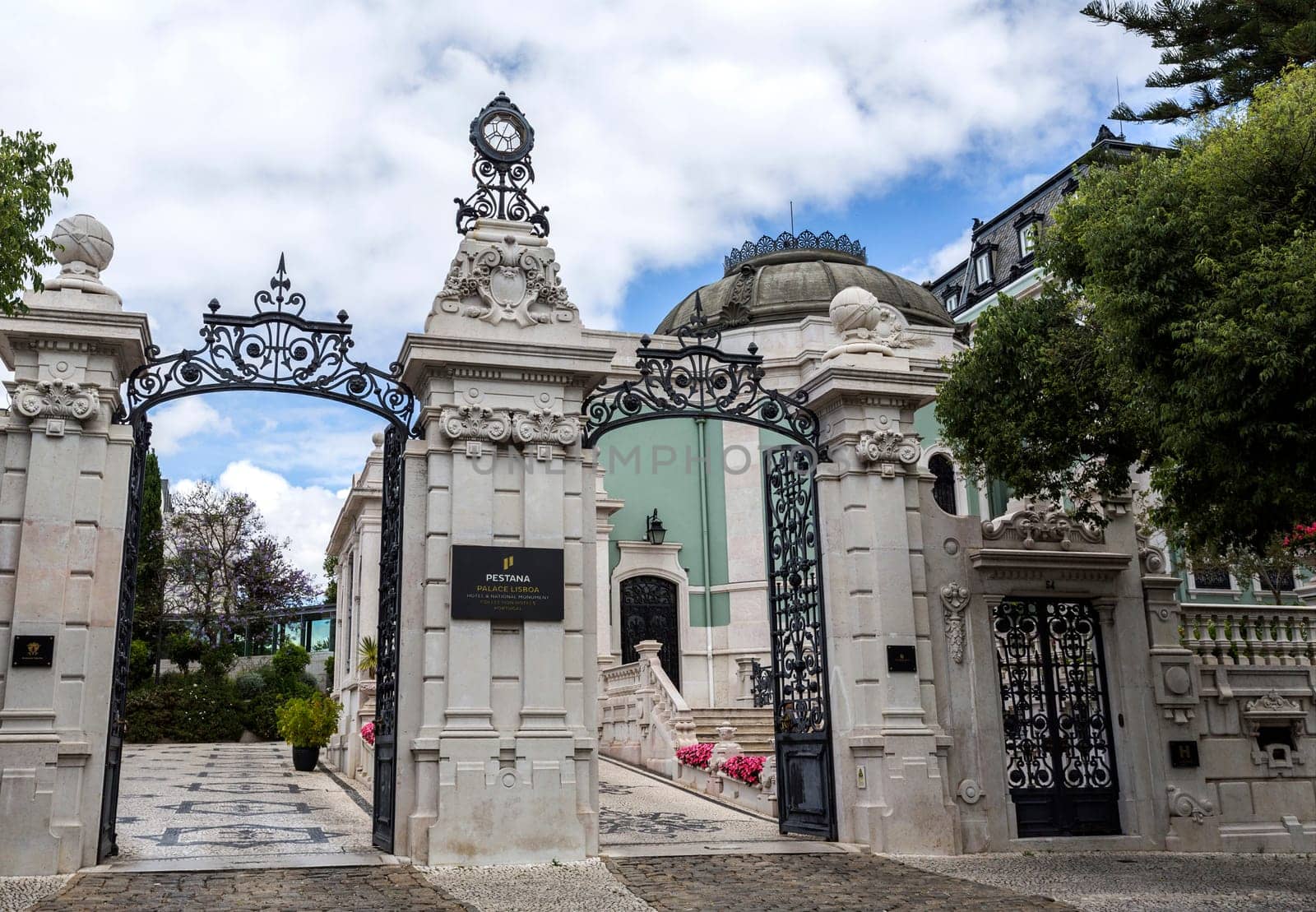 Main gate of the 5 star hotel occupying the sumptuous neoclassical Vale Flor Palace built in early 20th century in Lisbon, Portugal