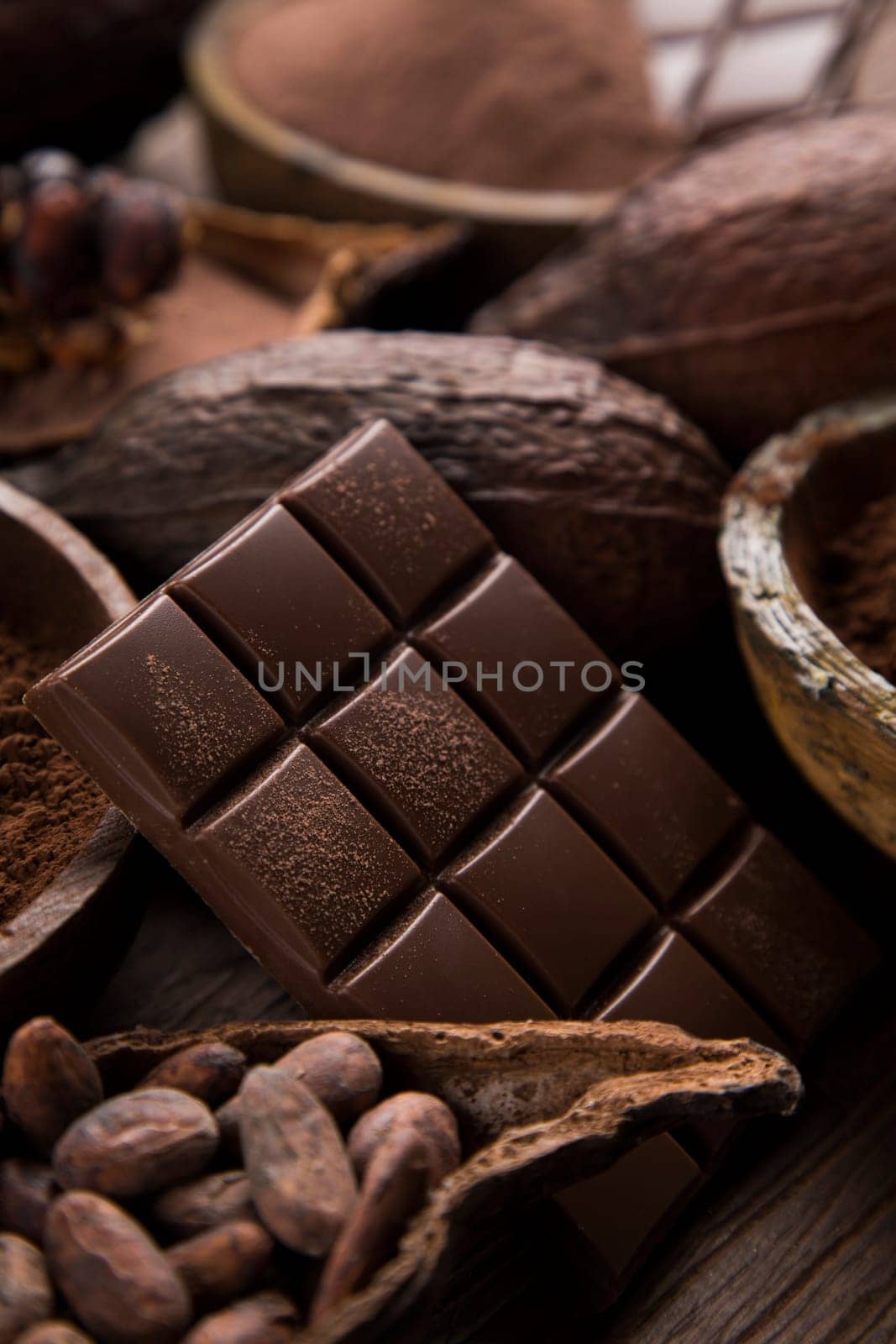 Milk and dark chocolate on a natural paper background