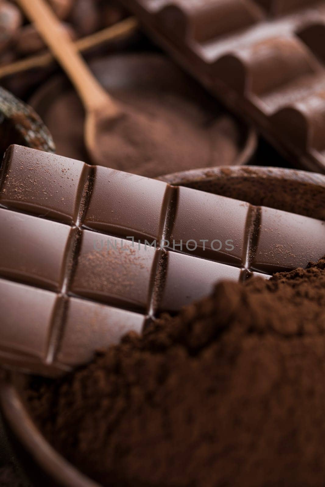 Milk and dark chocolate on a natural paper background