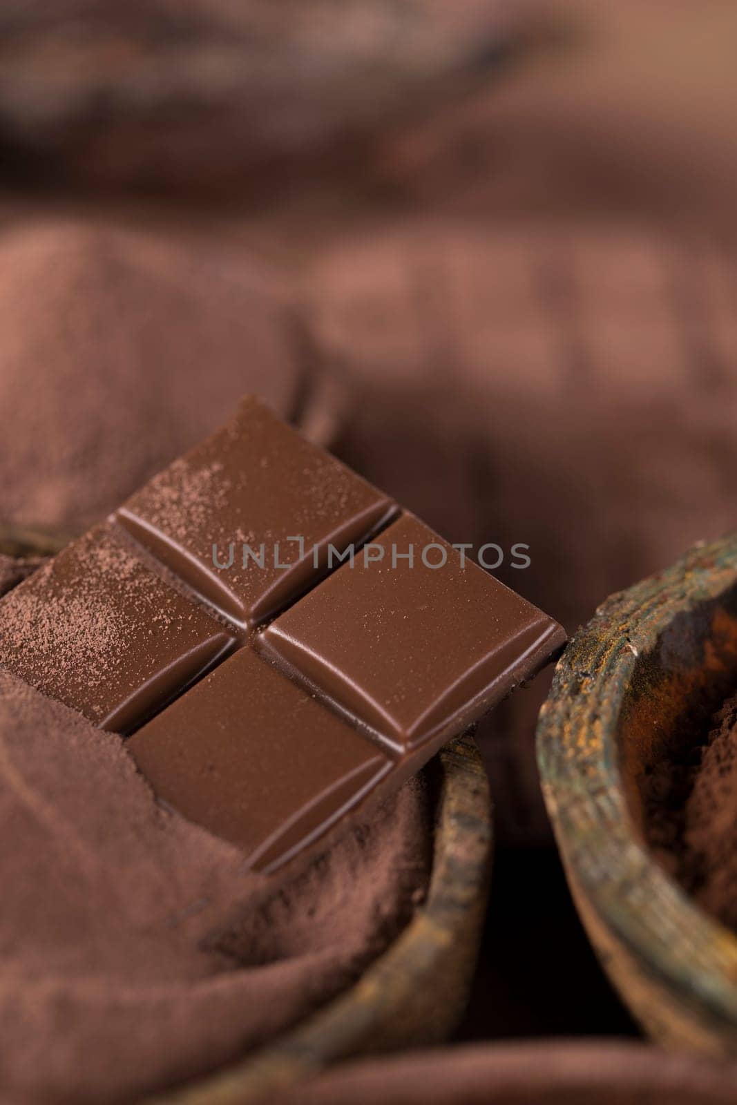 Aromatic cocoa and chocolate on natural paper background