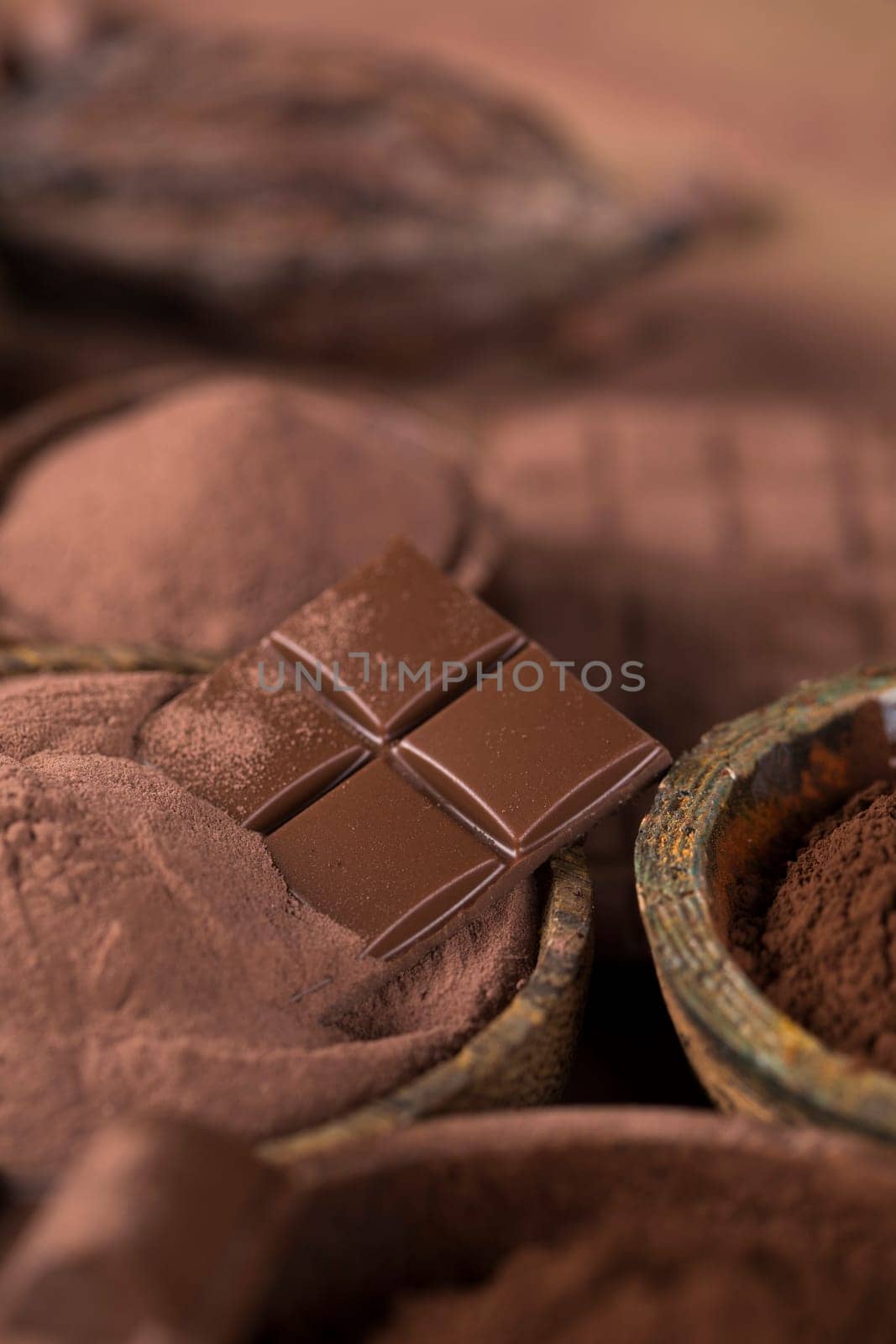 Milk and dark chocolate on a natural paper background