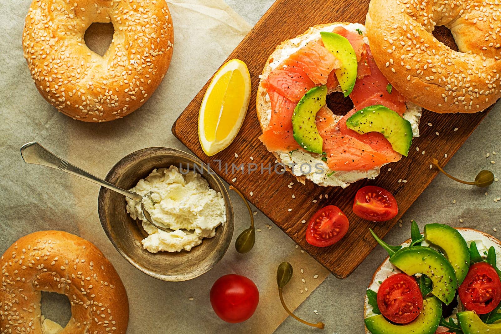 Bagel sandwich with avocado salmon cream cheese. Healthy food.