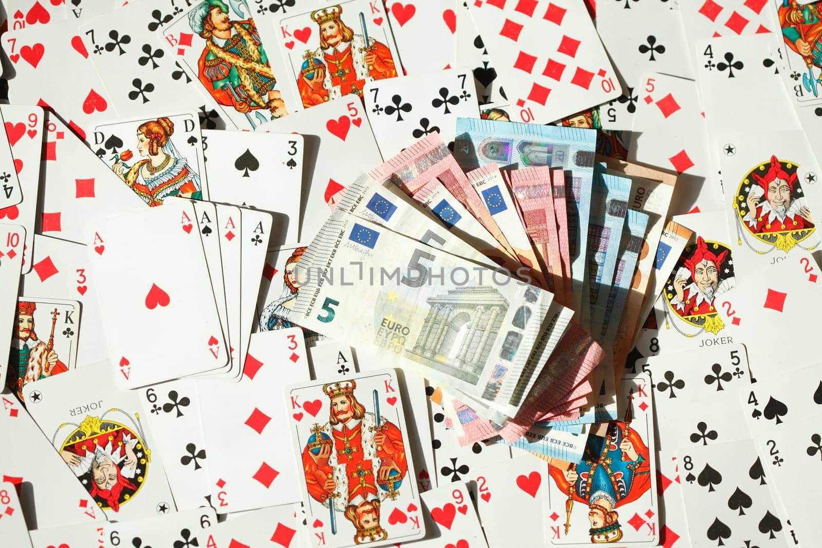Four aces, various colorful playing cards, euro banknotes, background picture, abstract